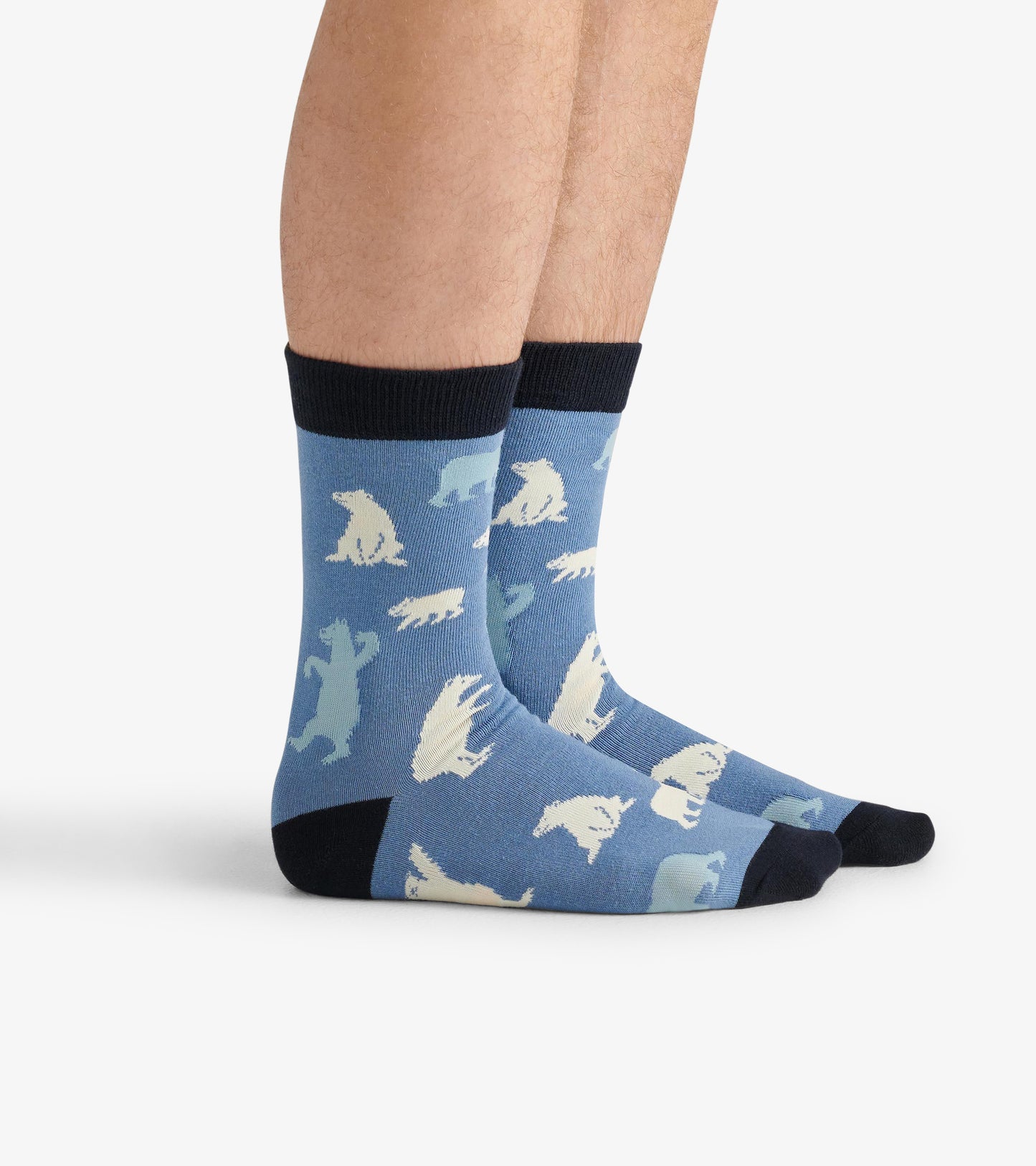 Blue crew socks featuring polar bear patterns in white and light blue, with a dark blue cuff and toe.