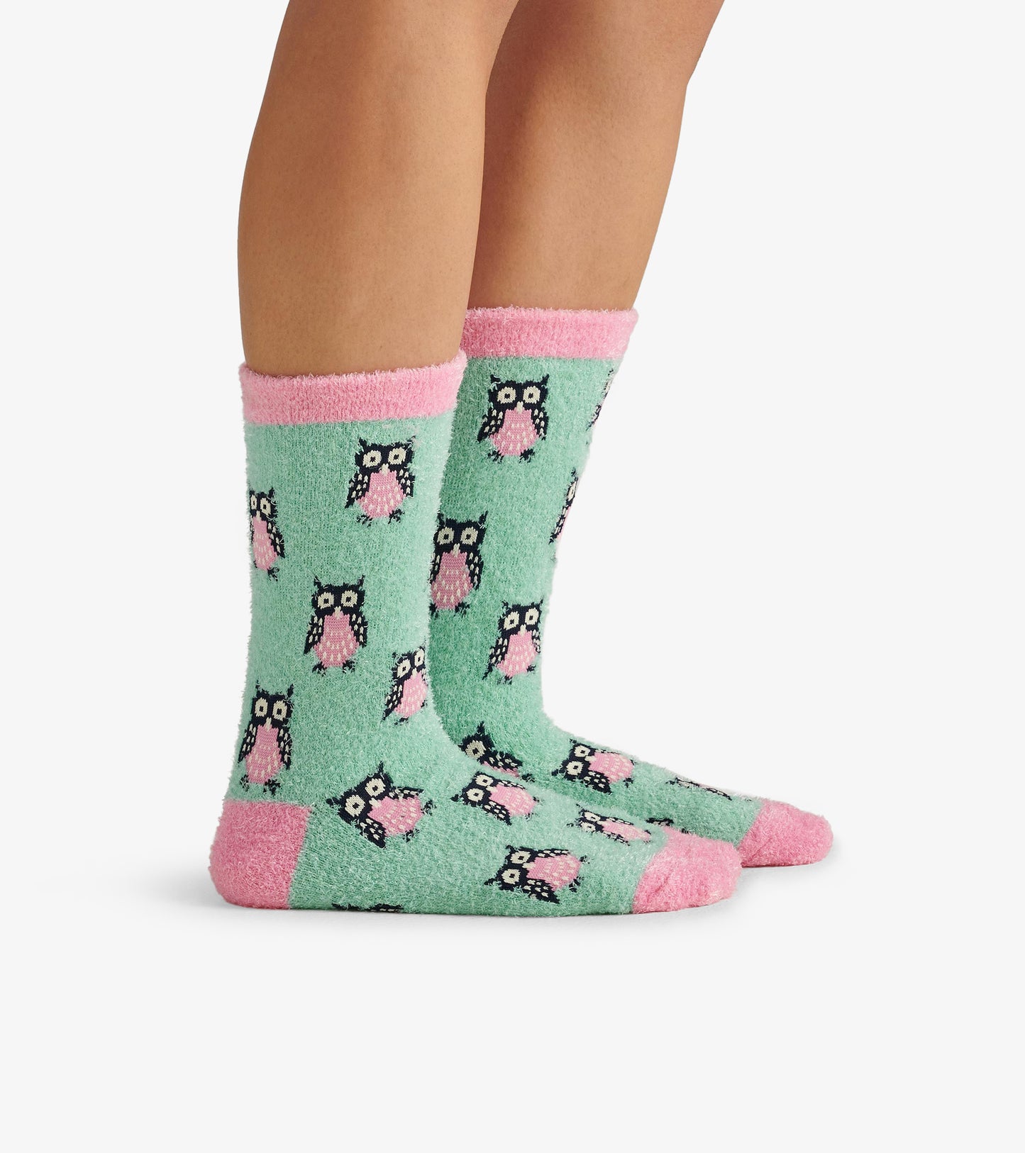 Fuzzy mint green socks with pink accents, featuring an owl pattern, designed for comfort and warmth.