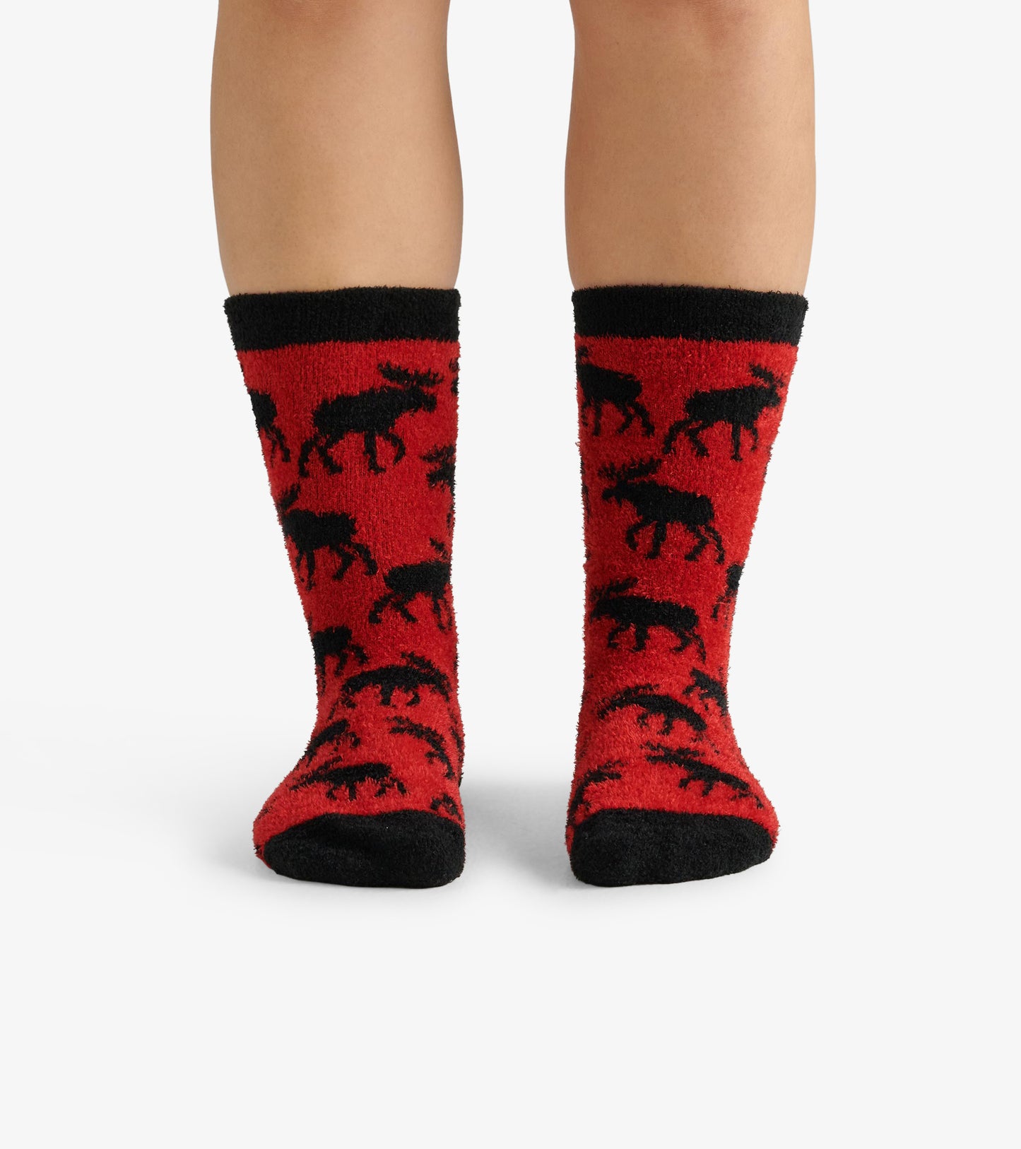 Red fuzzy socks featuring a black moose pattern and a black cuff, designed for warmth and comfort.