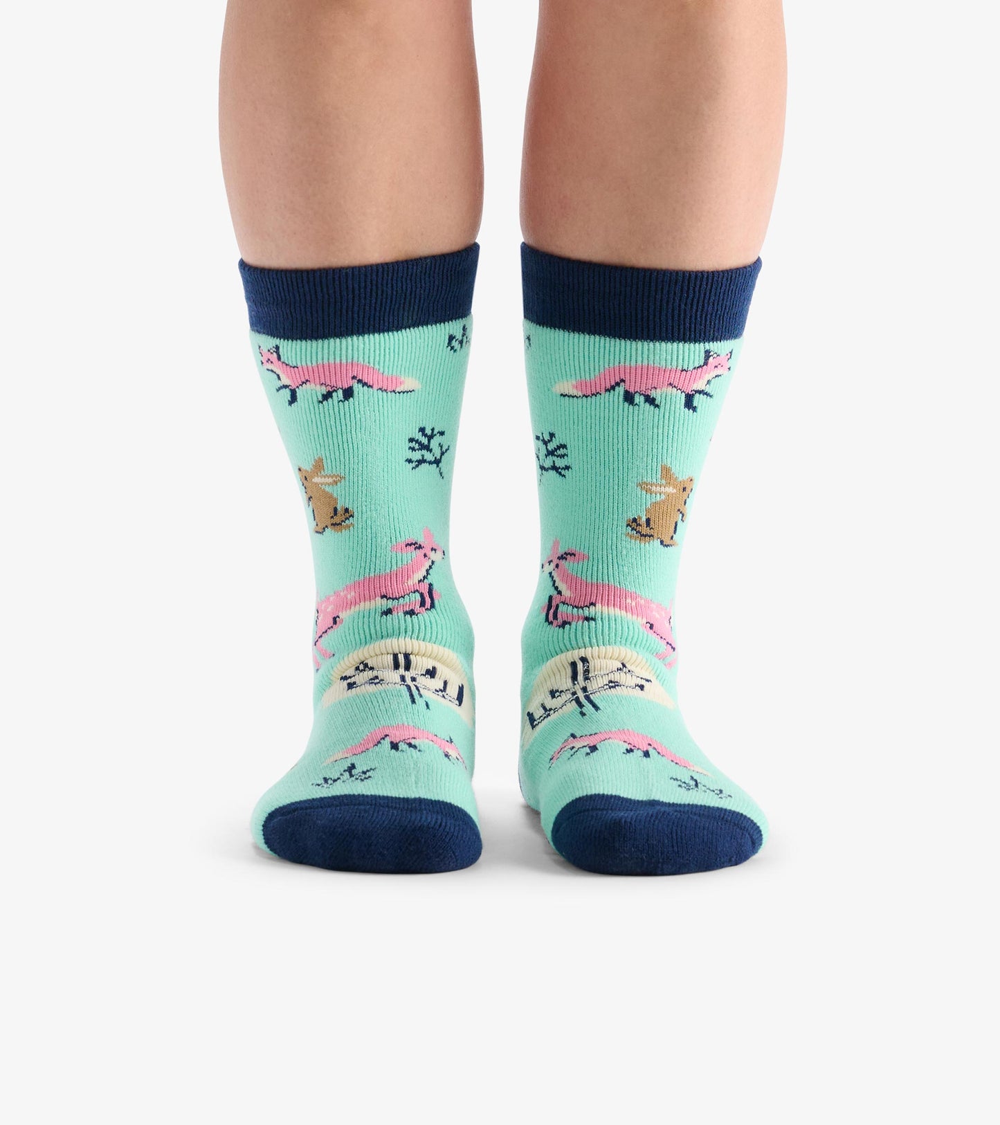 Light blue cozy socks featuring colorful forest animal patterns and a navy ribbed cuff. One size fits most.