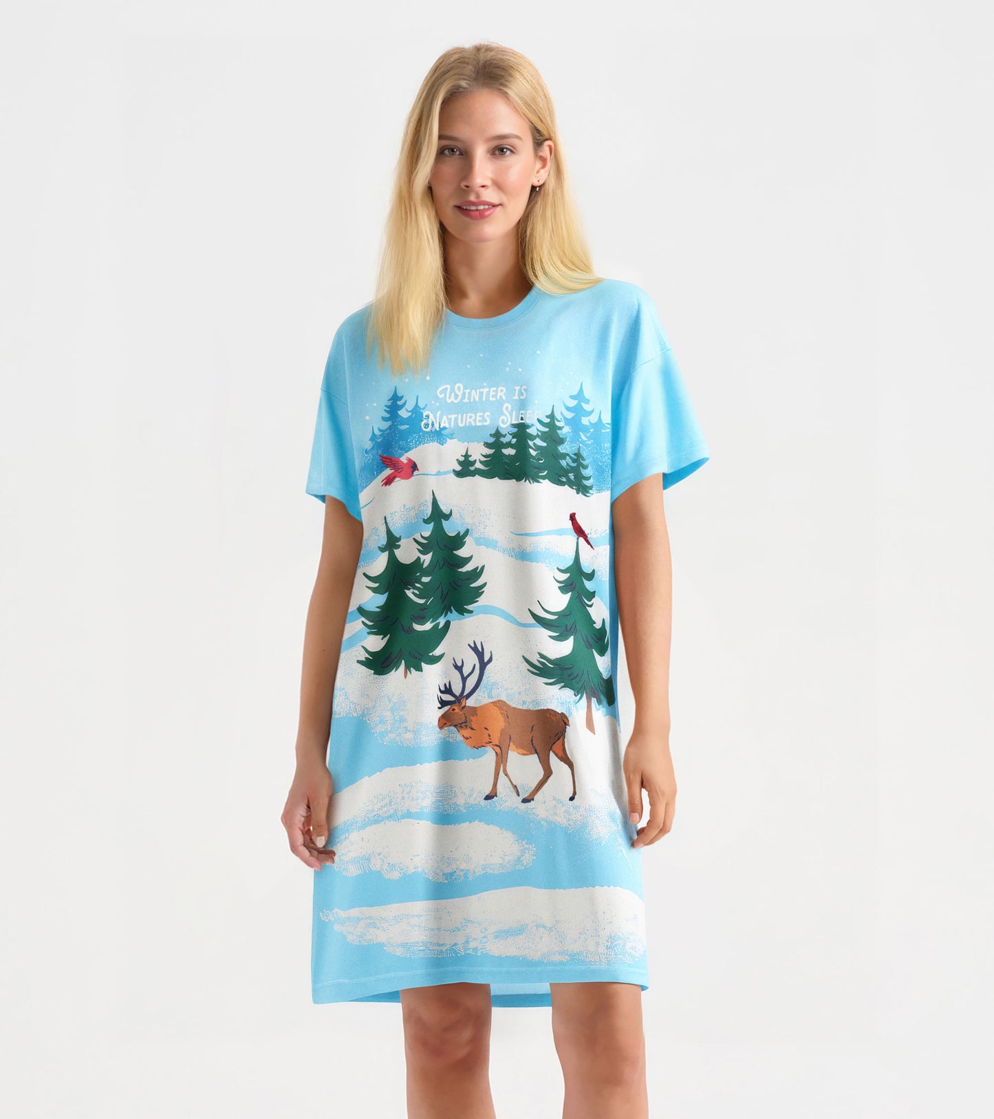 Light blue sleepshirt featuring winter scene with trees, cardinals, and a moose, designed for cozy wear.