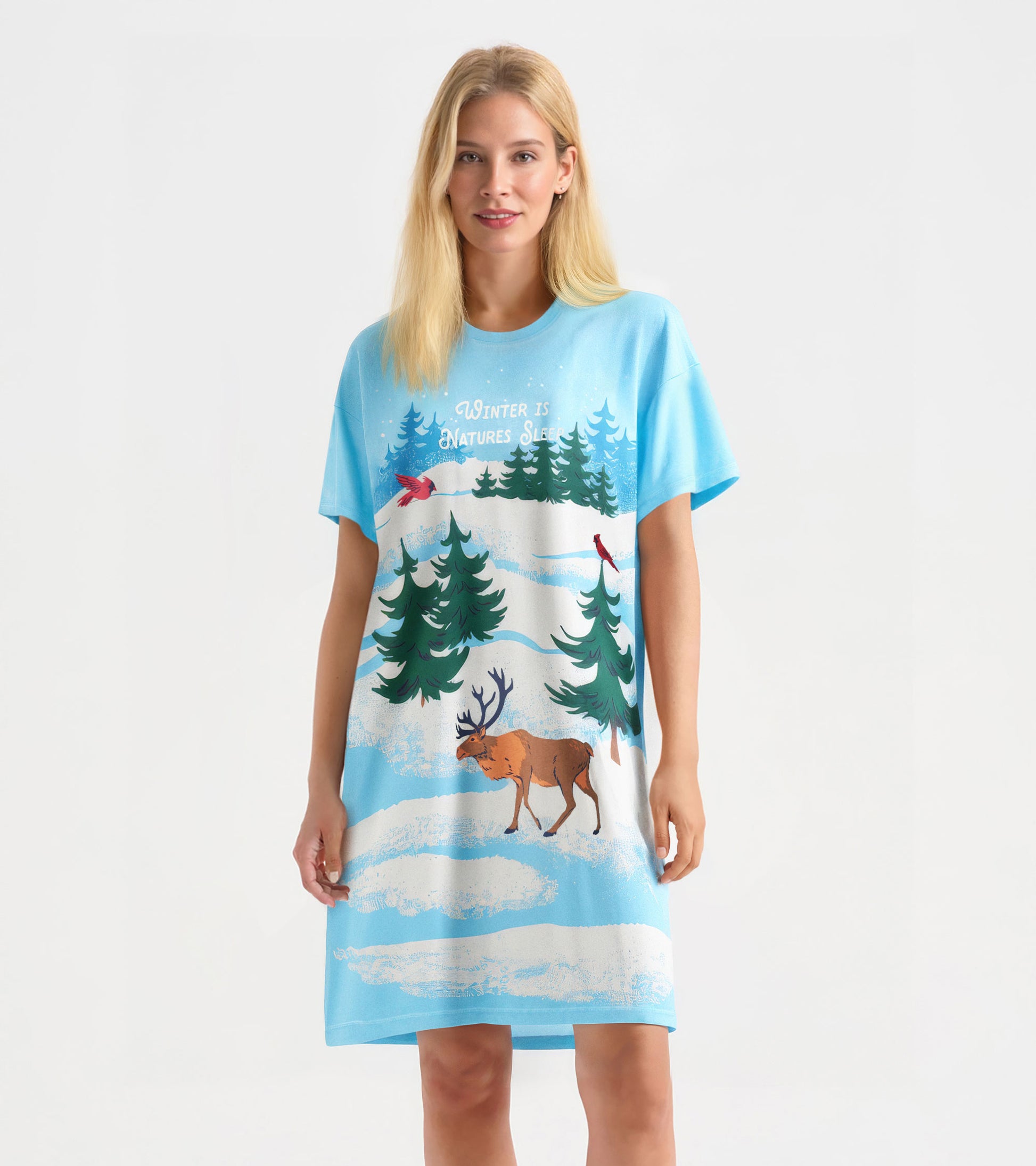 Light blue sleepshirt featuring winter scene with trees, cardinals, and a moose, designed for cozy wear.