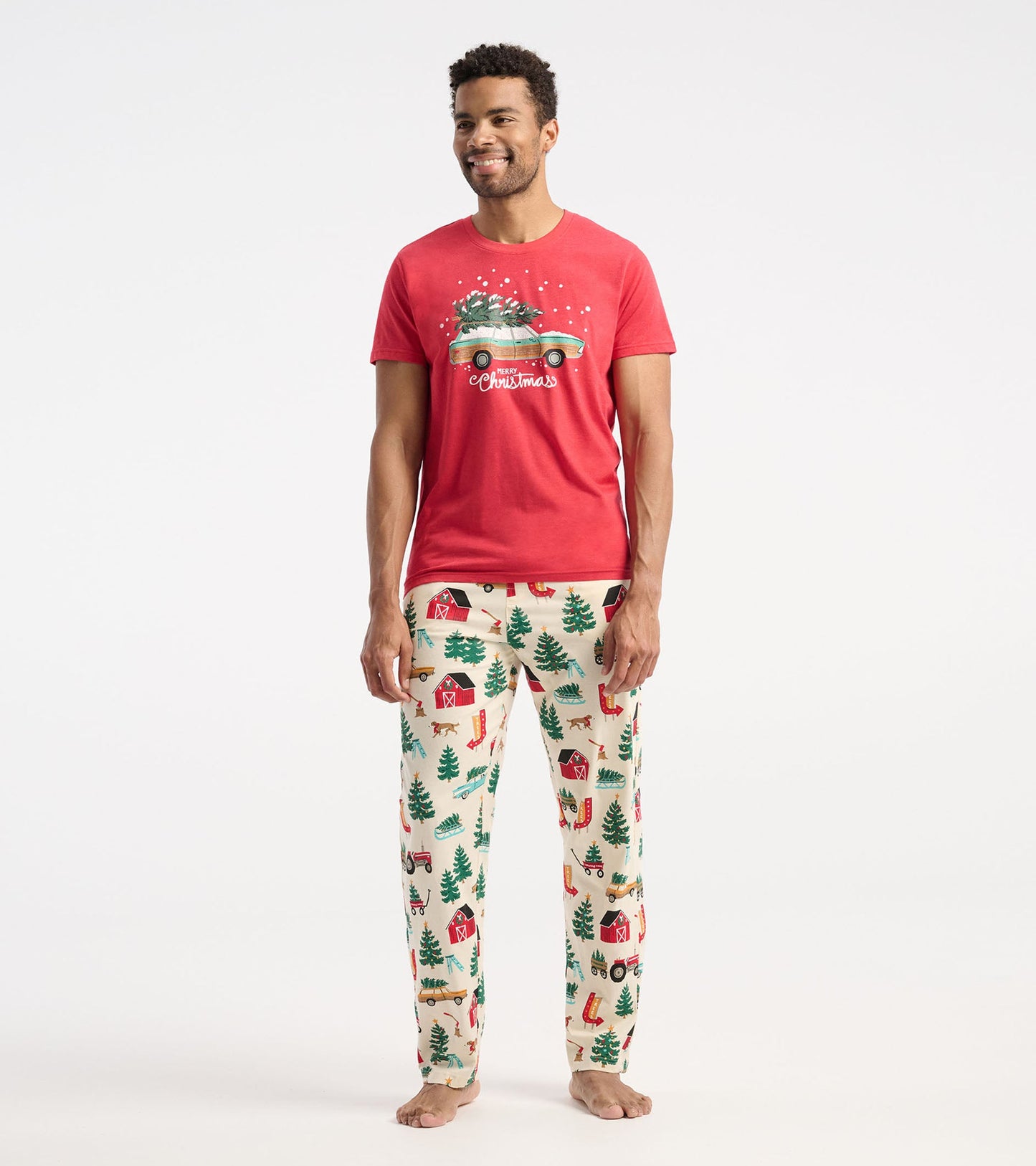 Red short-sleeve t-shirt featuring a Christmas-themed graphic with a car and trees, paired with festive patterned pants.