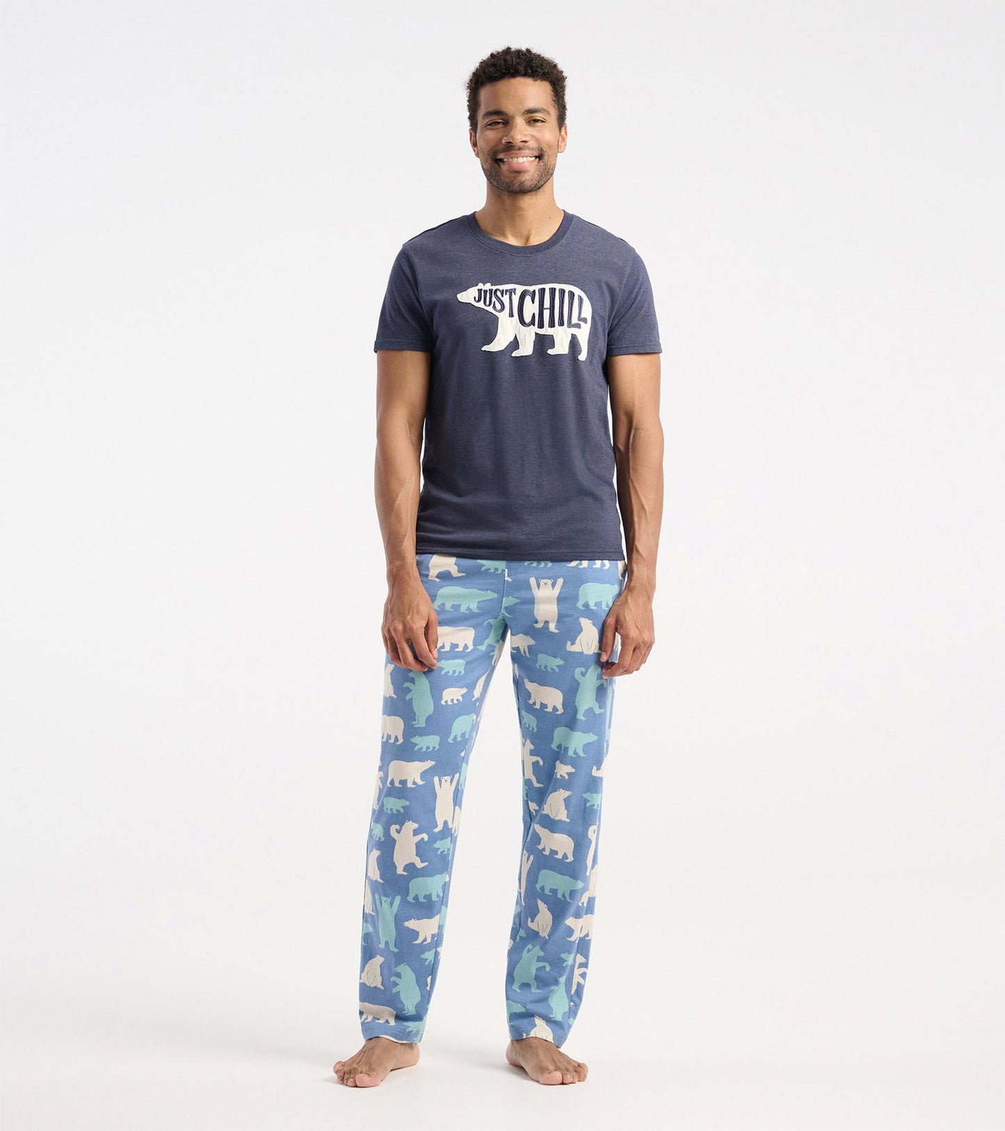 Navy blue short-sleeve t-shirt with a bear graphic and "Just Chill" text, paired with patterned pajama pants.