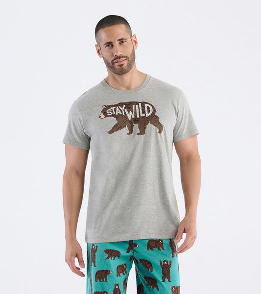 Gray short-sleeve t-shirt featuring a bear graphic and the text "STAY WILD," worn with patterned pajama pants.