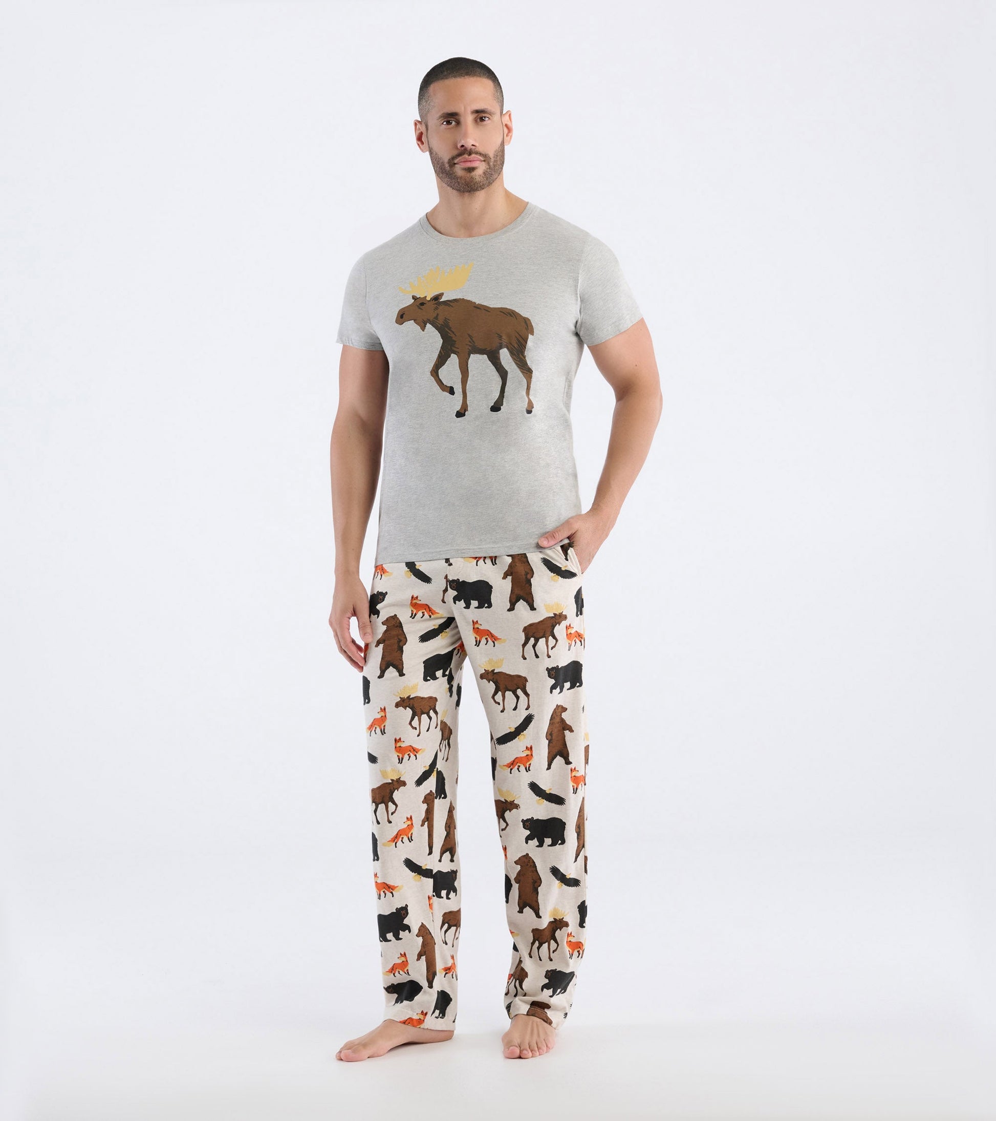 Gray short-sleeve tee featuring a moose graphic, paired with patterned pajama pants showcasing various wildlife animals.