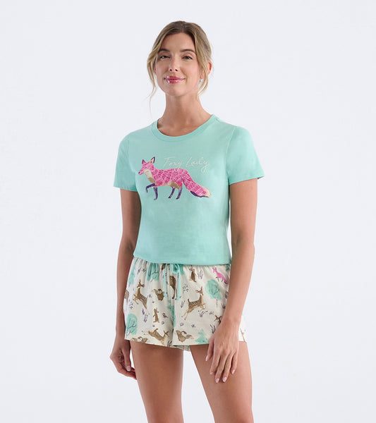 Mint green pajama t-shirt featuring a pink fox graphic, paired with cream shorts adorned with woodland animal prints.