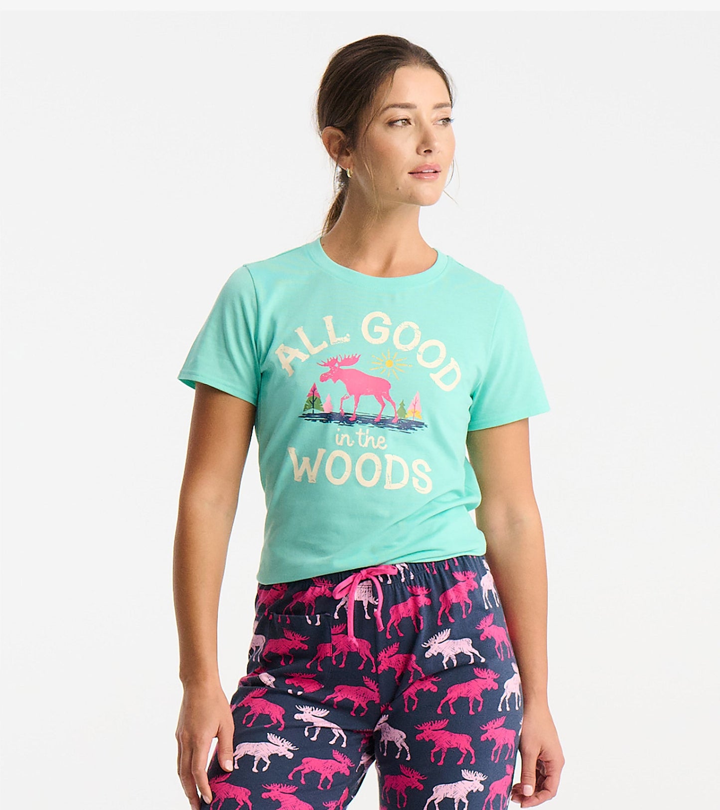 Light teal short-sleeve pajama t-shirt featuring a colorful moose and nature graphic.
