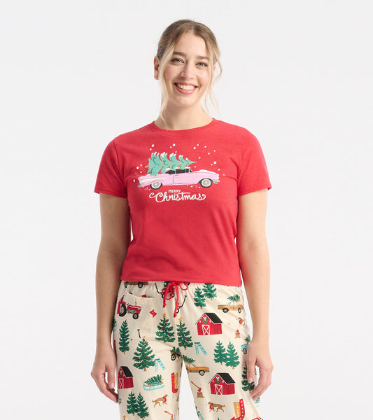 Red short-sleeve pajama tee featuring a festive graphic of a car with Christmas trees and the text "Merry Christmas.