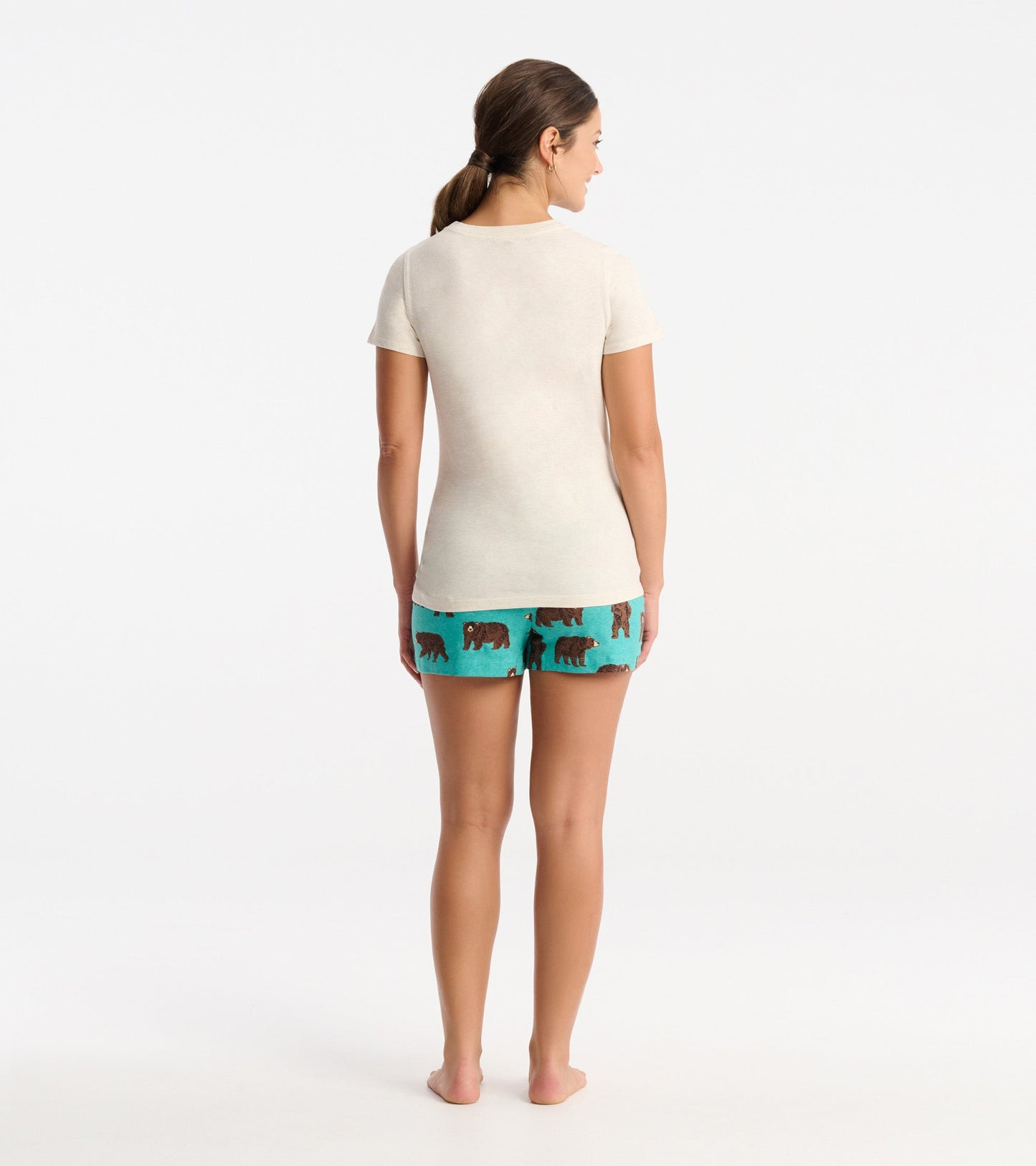 Light beige short-sleeve pajama t-shirt, paired with teal shorts featuring bear prints, shown from the back.