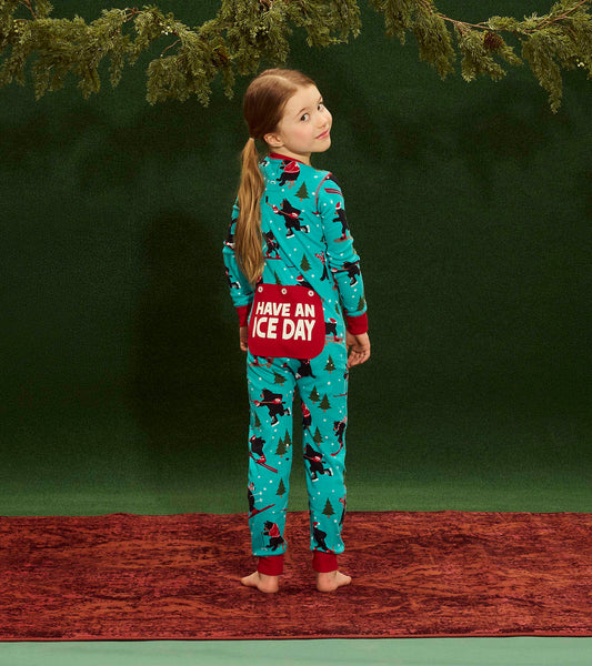 Turquoise kids' onesie with festive patterns, red cuffs, and a "Have an Ice Day" pocket, shown from the back.