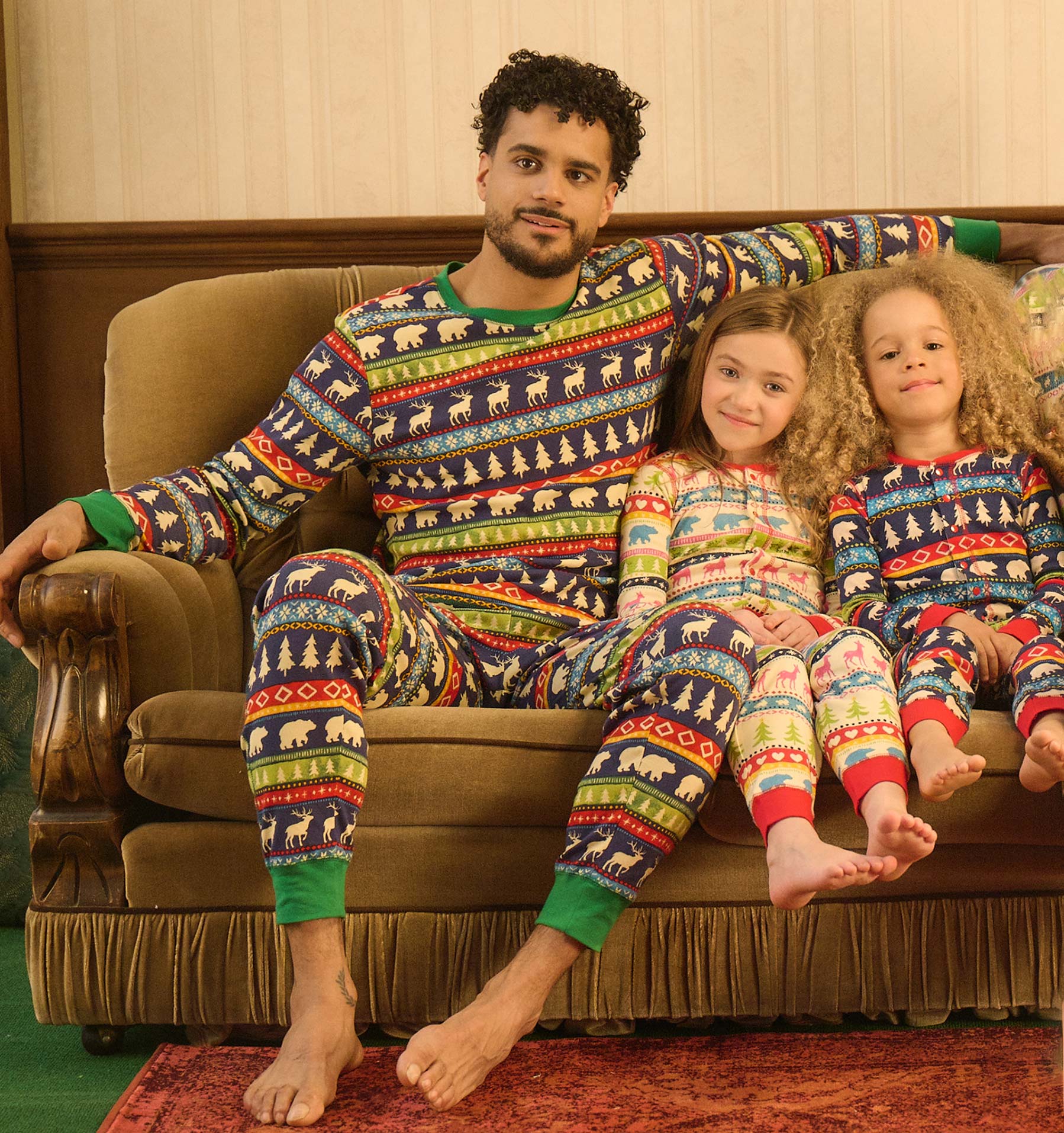 Colorful Fair Isle patterned onesie in soft fabric, featuring animals and trees, suitable for kids.