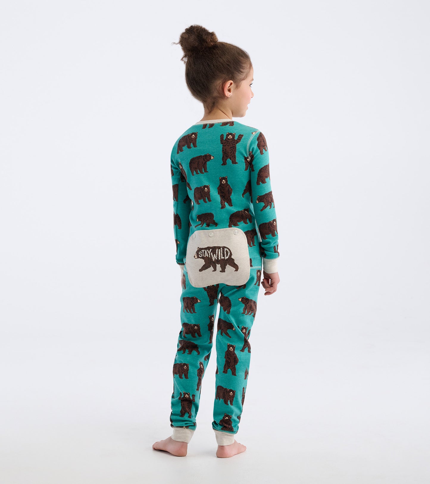 Turquoise onesie featuring brown bear patterns, with a "Stay Wild" patch on the back, designed for kids.