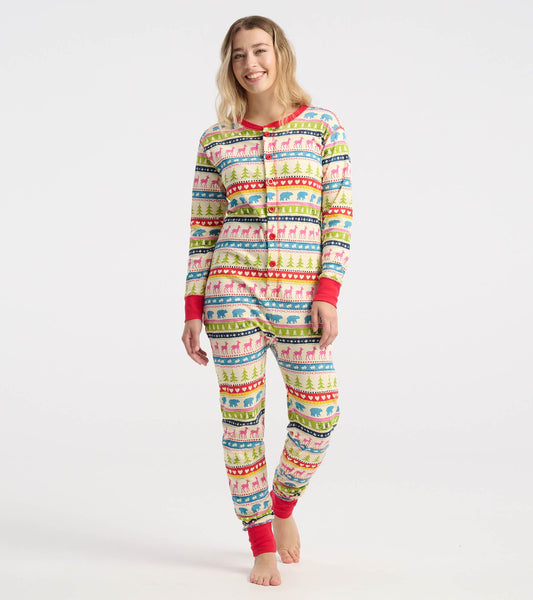 Colorful Fair Isle onesie featuring festive patterns with animals and trees, long sleeves, and red cuffs.