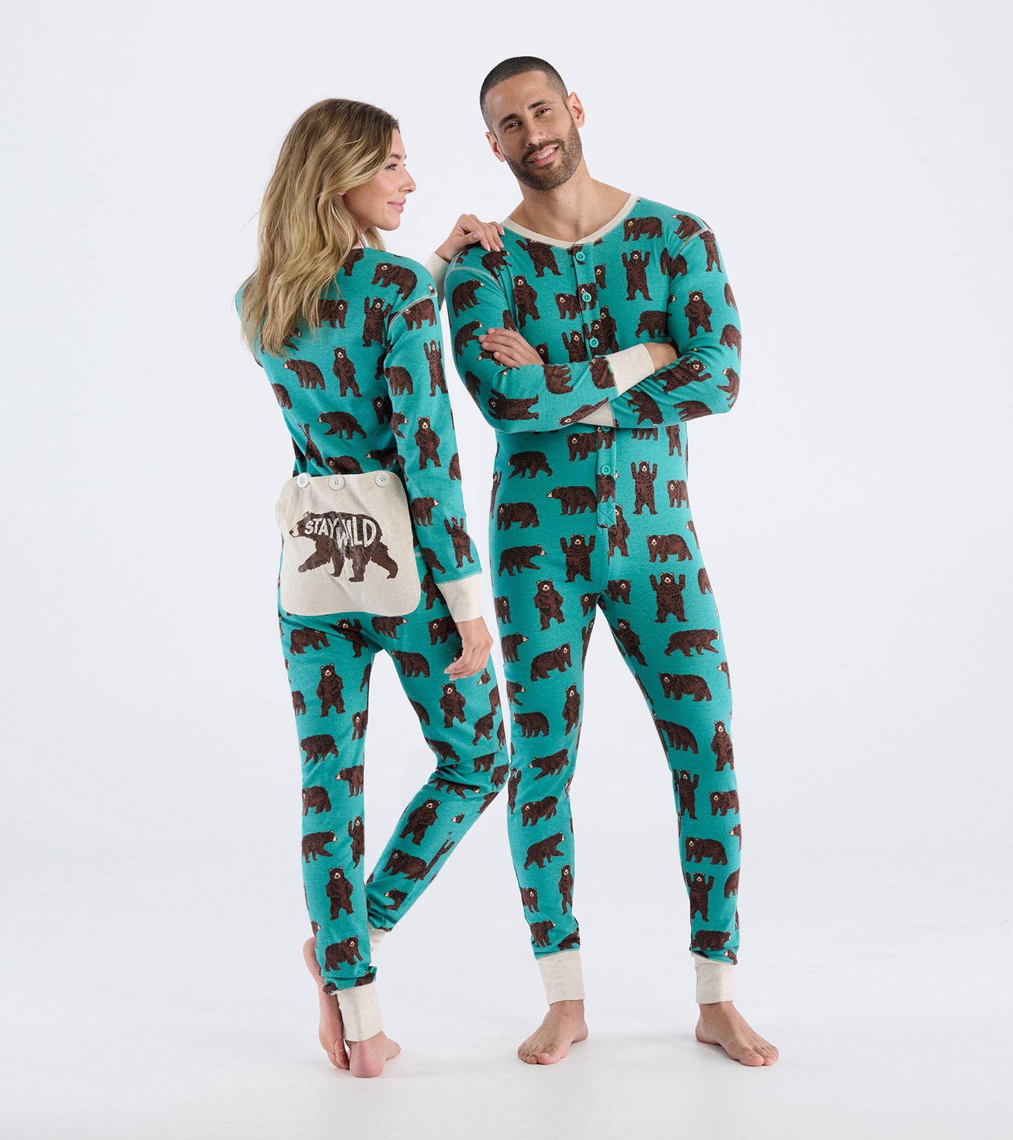 Turquoise onesie featuring brown bear patterns, with long sleeves and a button front, suitable for casual wear.