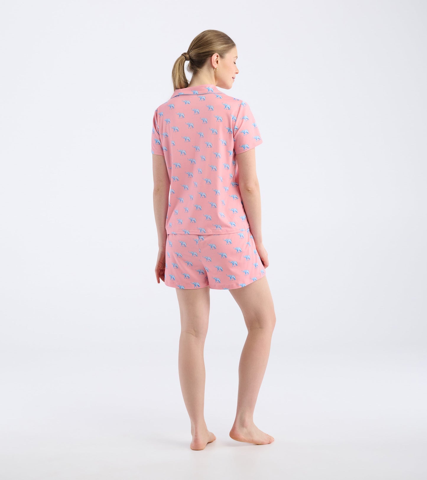 Pink short pajama set featuring a playful elephant pattern, shown from the back.