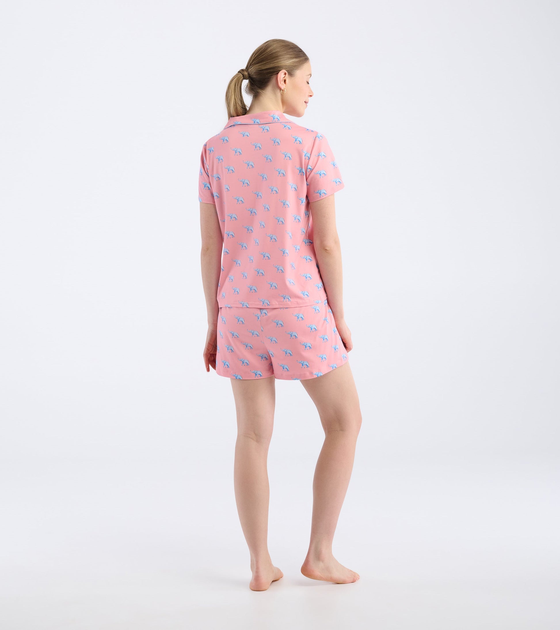 Pink short pajama set featuring a playful elephant pattern, shown from the back.