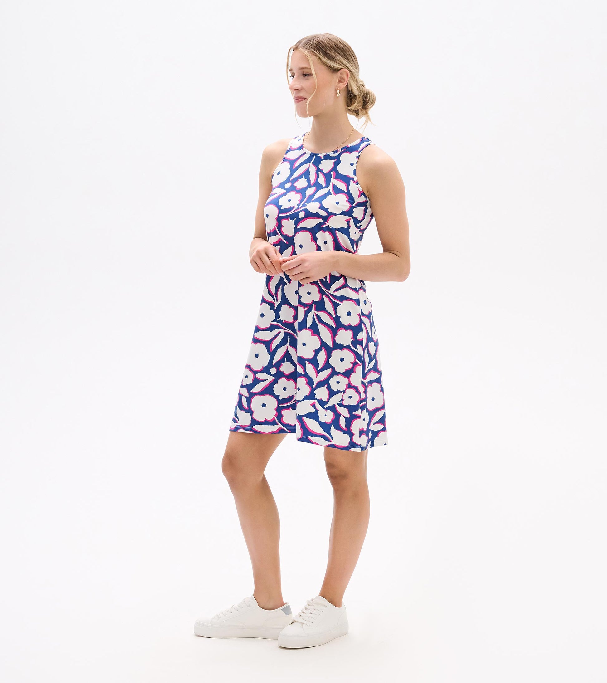 Sleeveless summer dress featuring a vibrant floral pattern in purple, pink, and white, with a relaxed fit.
