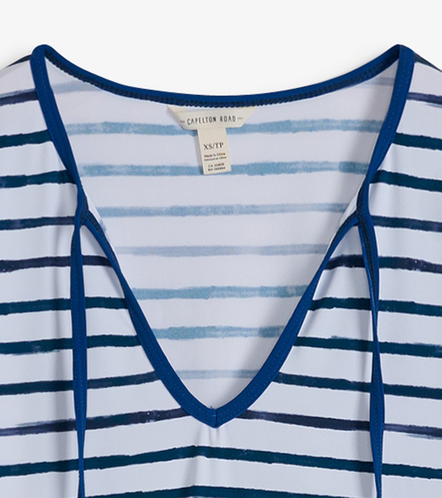 V-neck beach dress featuring watercolor stripes in blue and white, with a soft, lightweight fabric.
