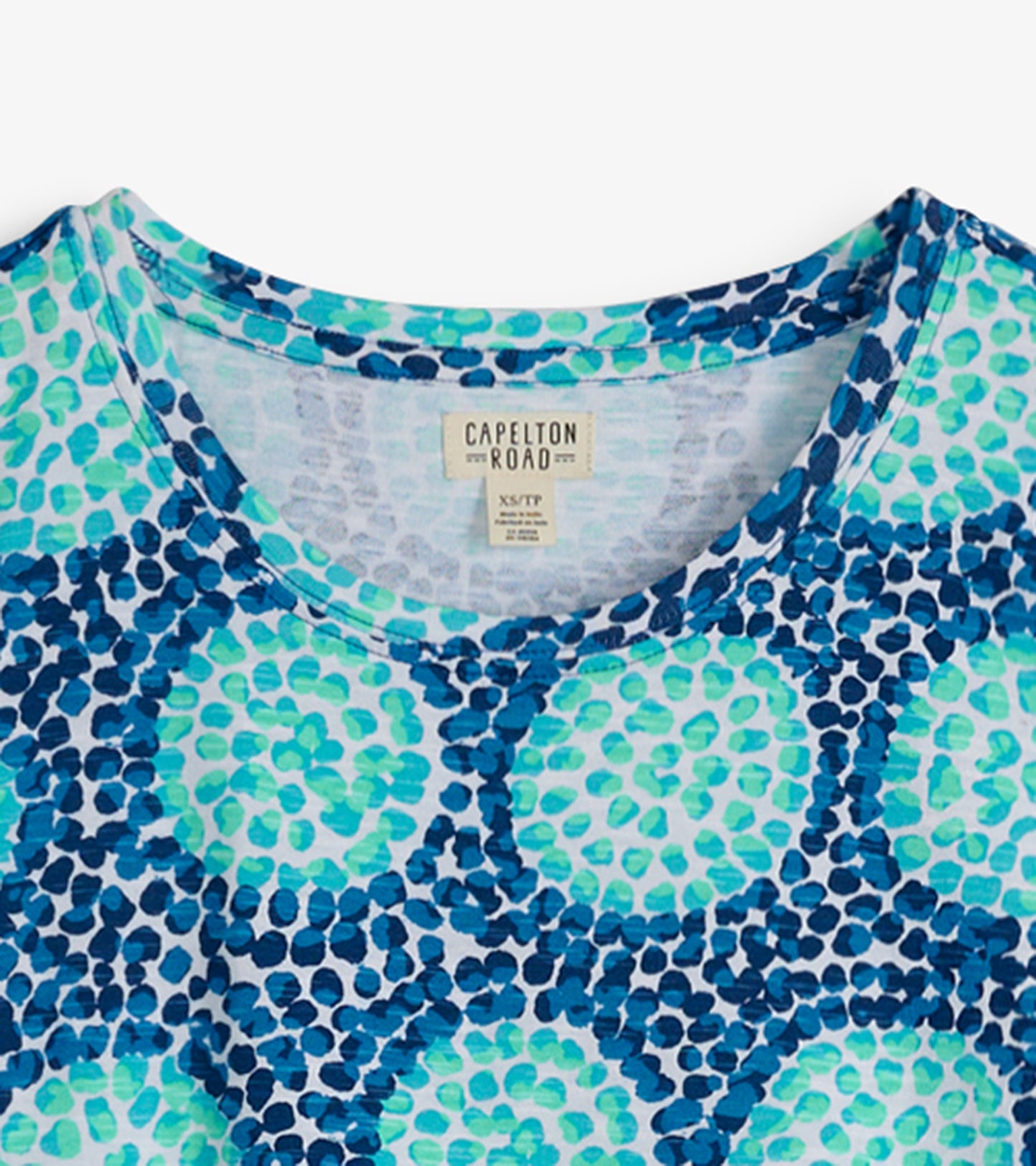 Crew neck t-shirt dress featuring a blue and green abstract pattern, made from soft fabric.