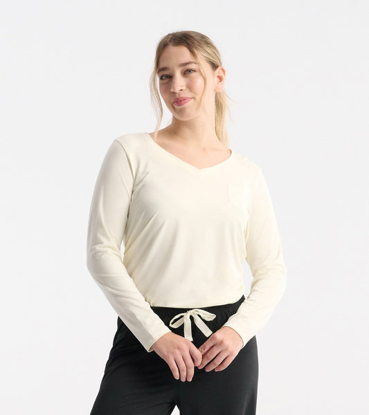 Light cream long sleeve T-shirt with a V-neck and pocket, made from soft polyknit fabric.