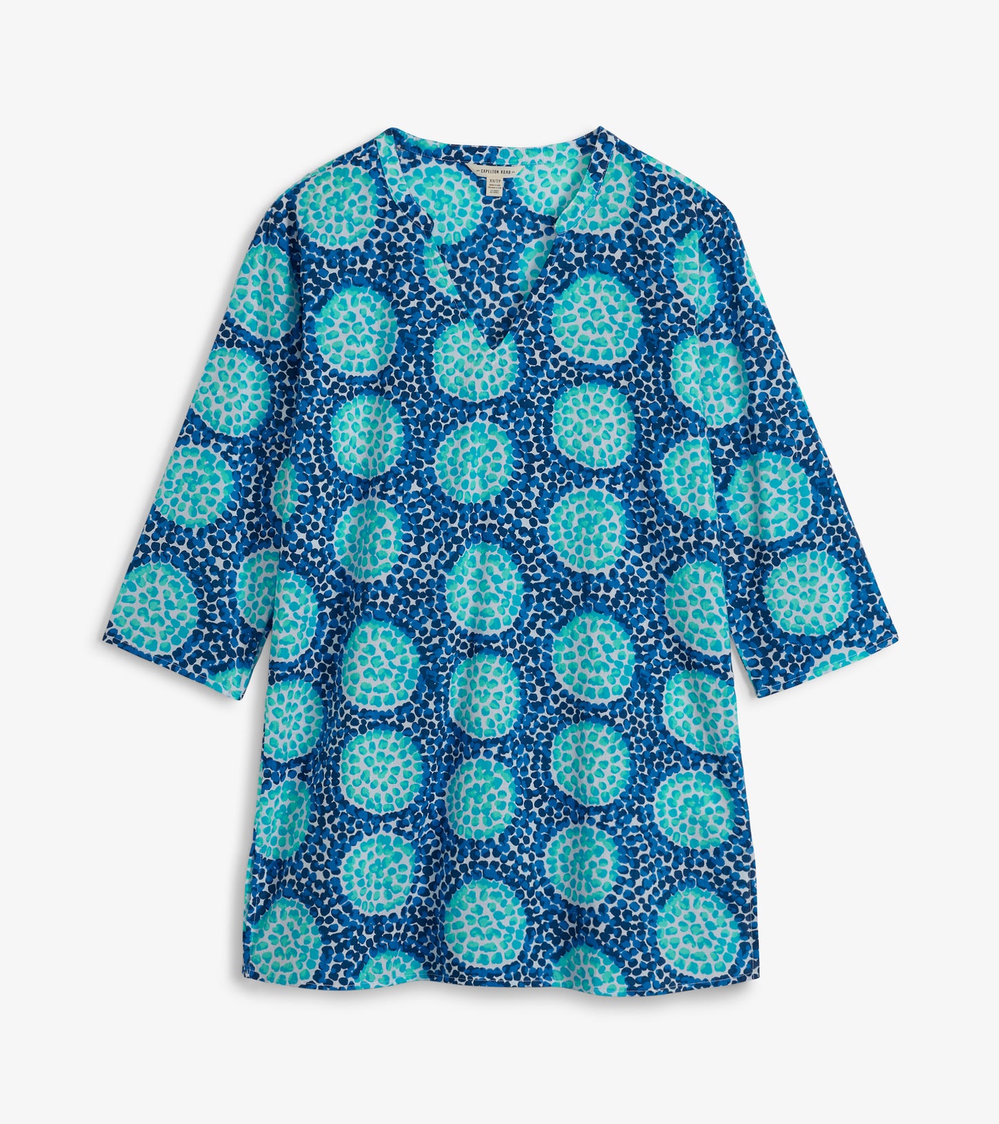 Blue tunic featuring a vibrant circular pattern in shades of turquoise and navy, with a V-neck and three-quarter sleeves.