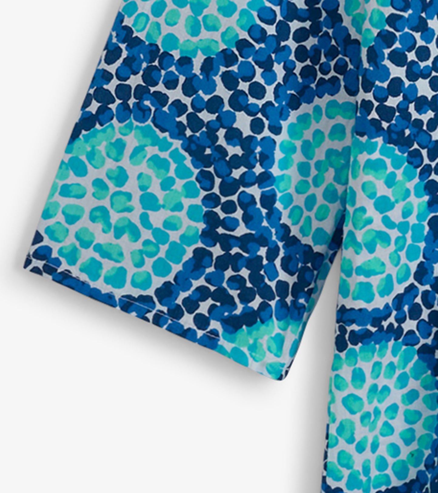 Colorful tunic featuring a blue and turquoise abstract pattern, made from lightweight fabric, suitable for casual wear.