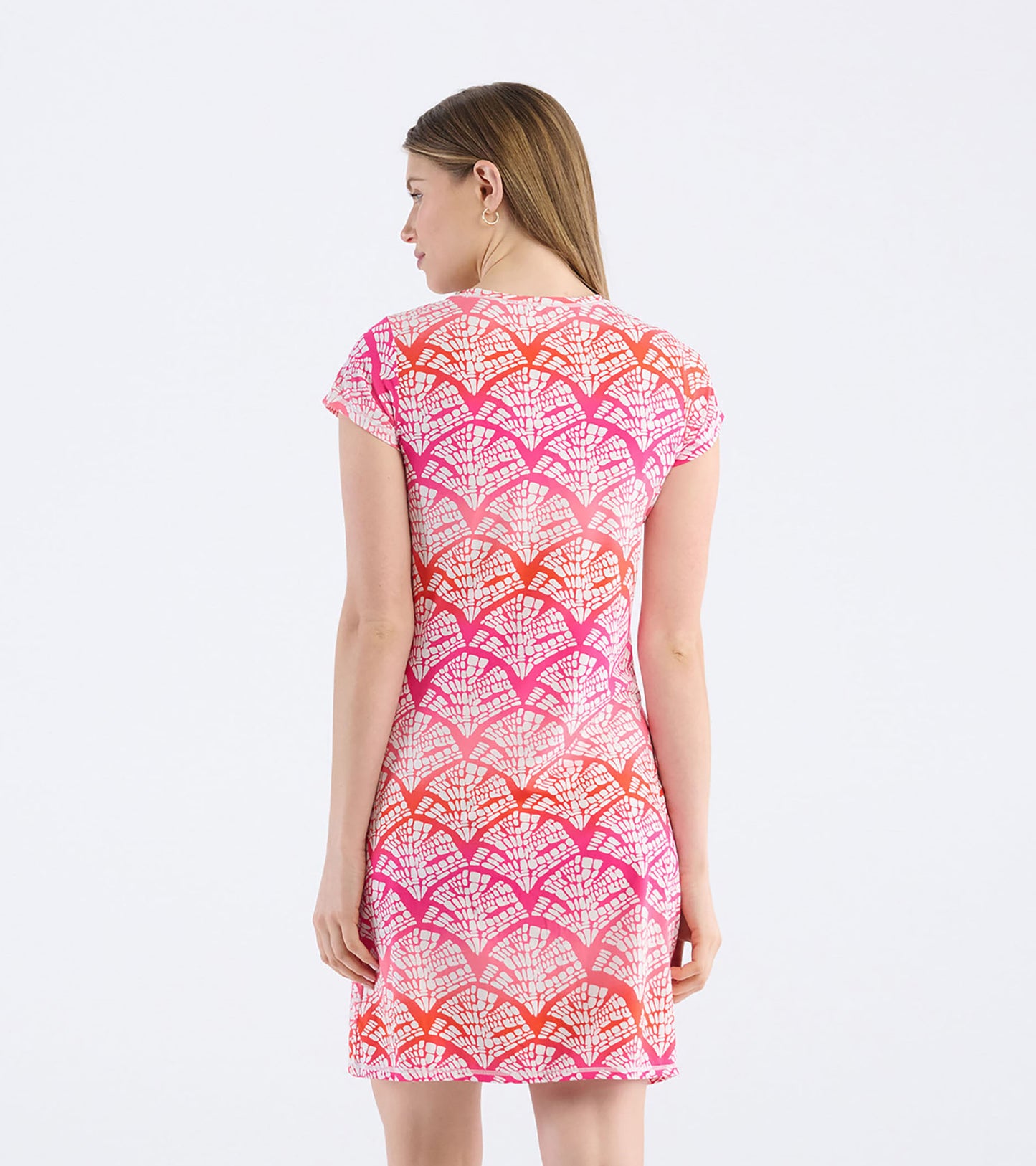 Back view of a fitted T-shirt dress featuring a vibrant pink and orange fan pattern on a lightweight fabric.