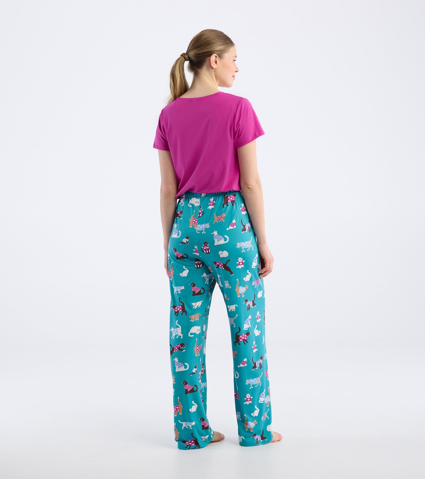 Teal pajama pants with a playful cat print, featuring an elastic waistband and a relaxed fit.