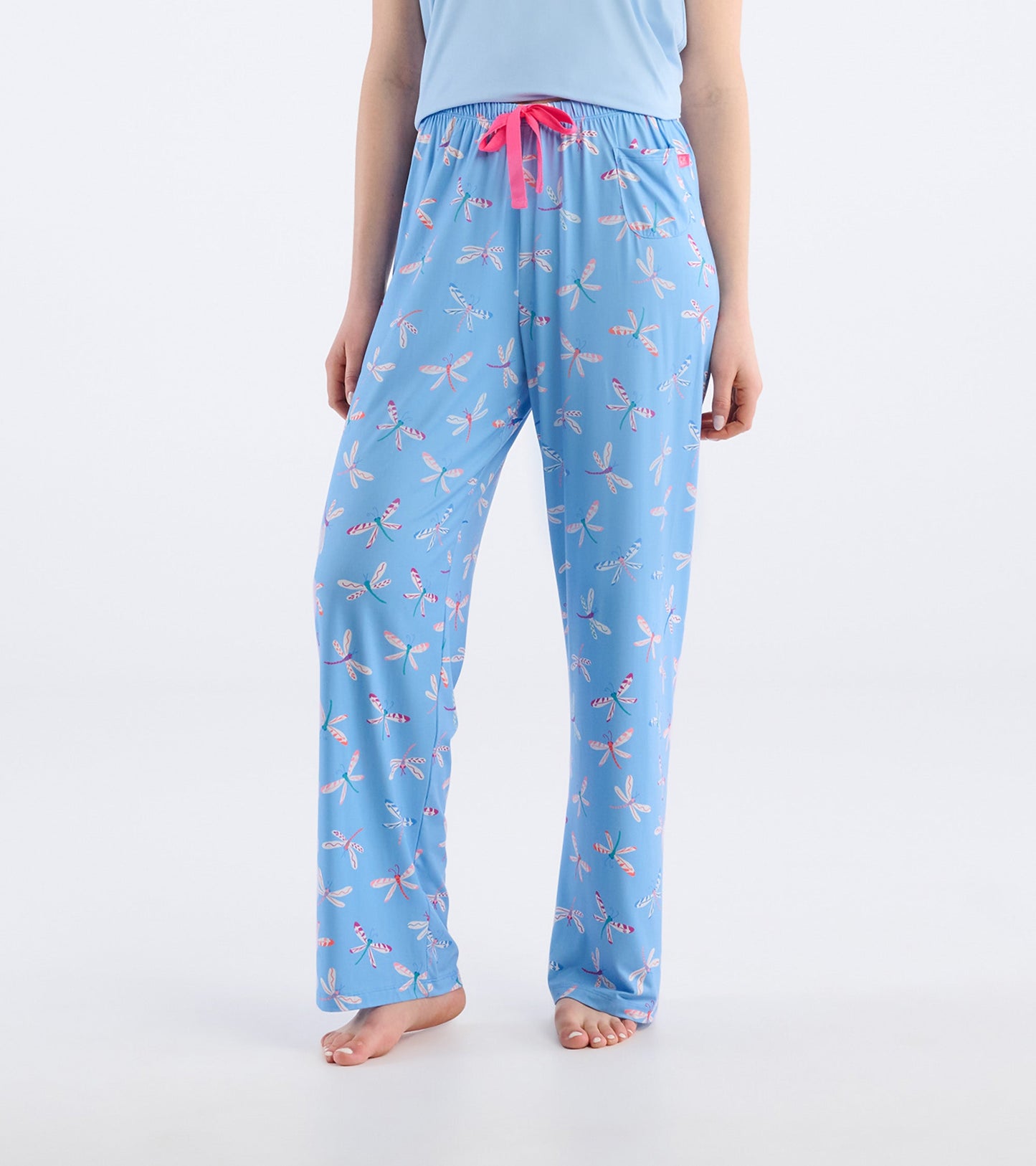 Light blue pajama pants featuring a colorful dragonfly pattern and a pink drawstring, ideal for comfortable lounging.
