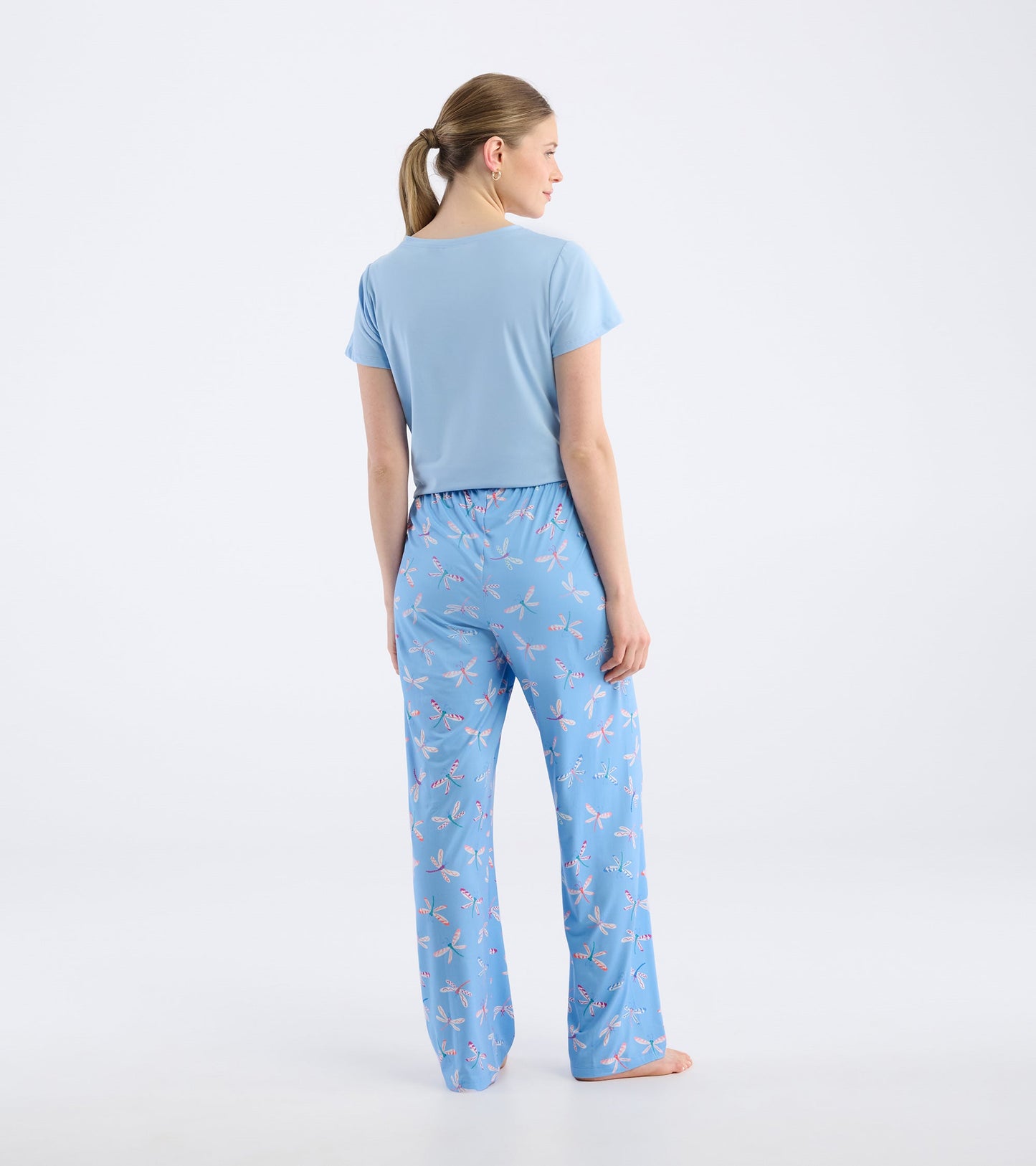 Light blue pajama pants featuring a colorful dragonfly pattern, designed for comfort and relaxation.