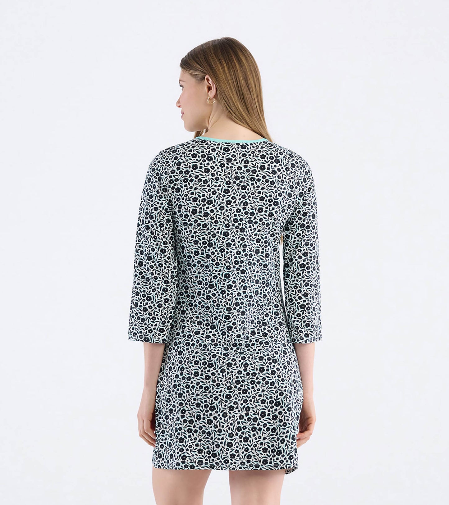 Black and white floral patterned mini dress with three-quarter sleeves and a round neckline, shown from the back.