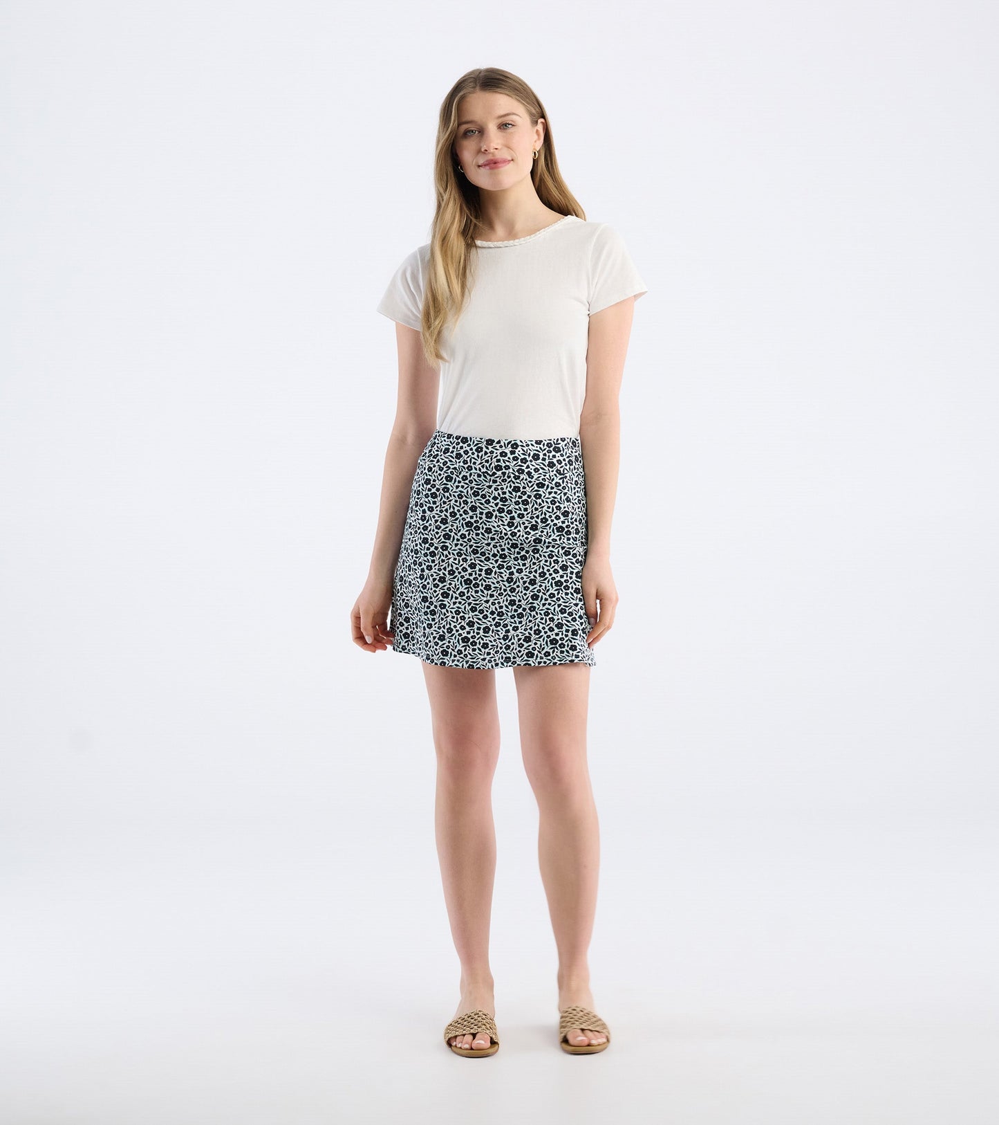 Floral-patterned skort in navy and white, featuring a relaxed fit and a flared shape, styled with a simple tee.