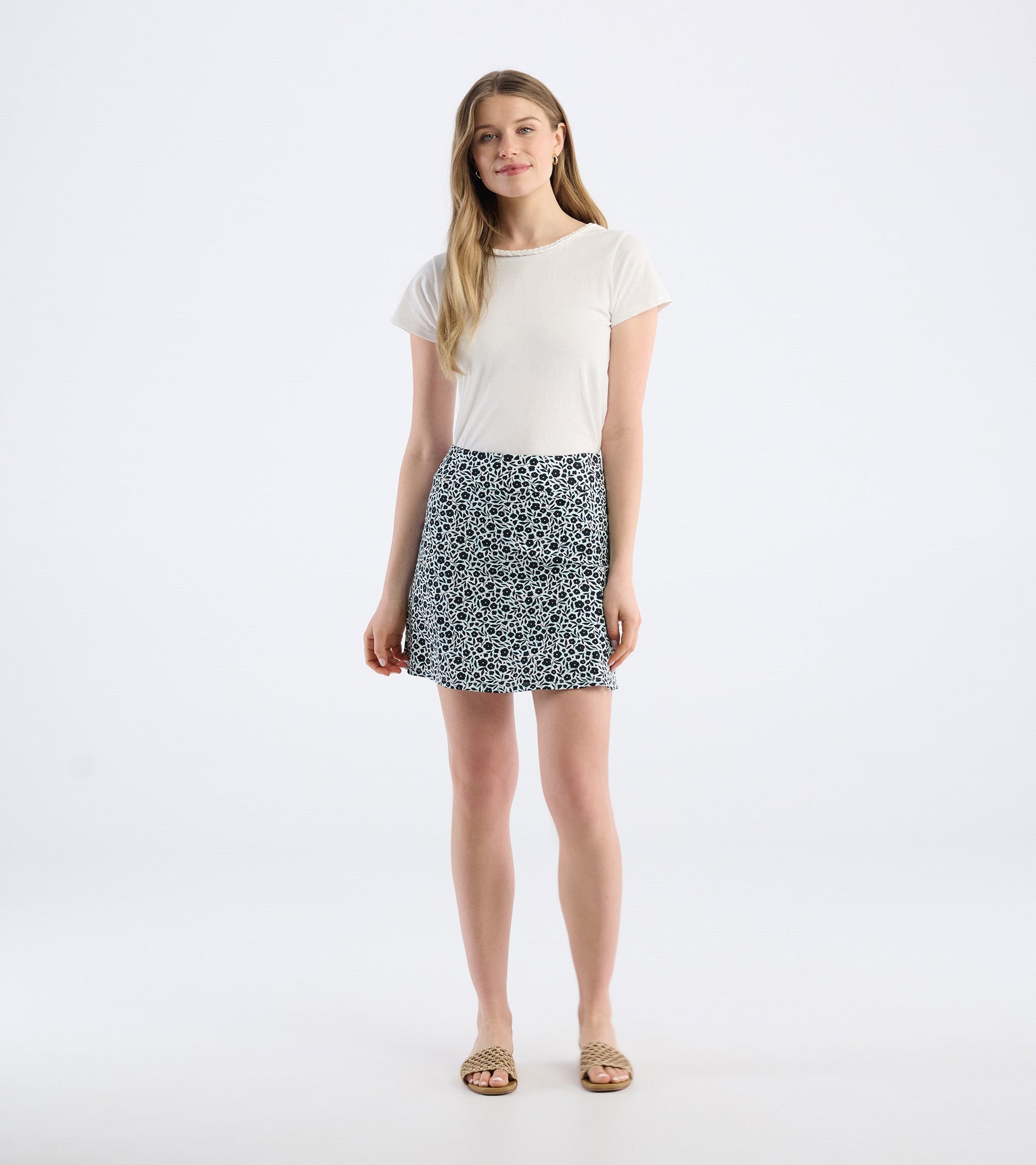 Floral-patterned skort in navy and white, featuring a relaxed fit and a flared shape, styled with a simple tee.