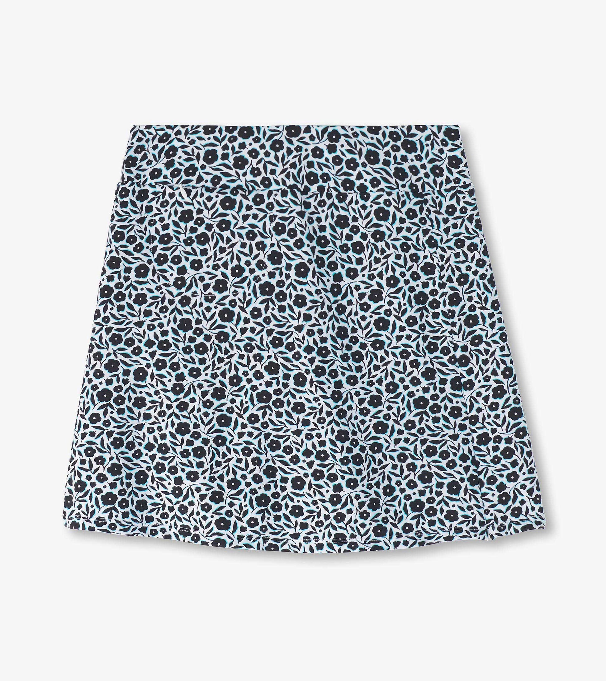 Floral-patterned skort in navy blue with light blue and black flowers, featuring a comfortable waistband.