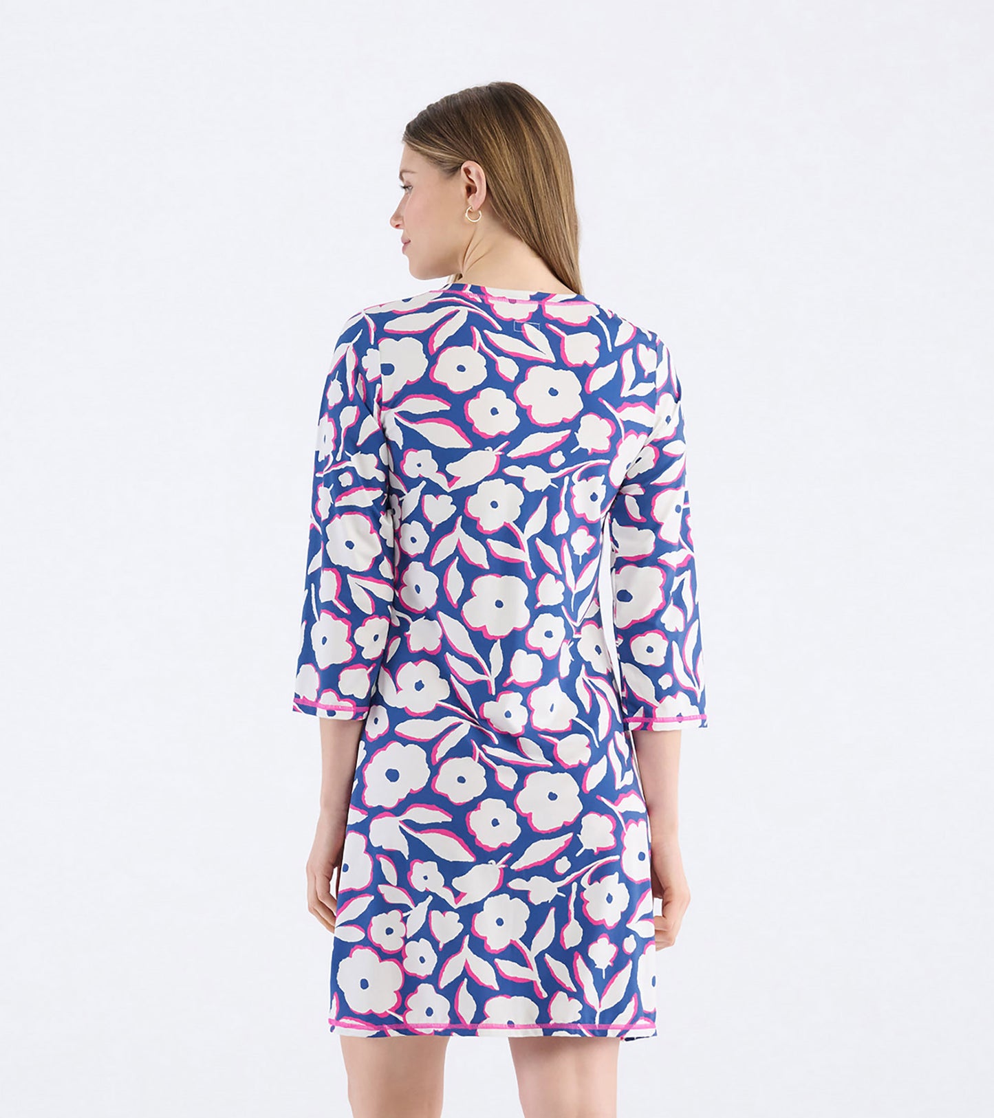 Back view of a women's dress featuring a floral pattern in navy, white, and pink with three-quarter sleeves.