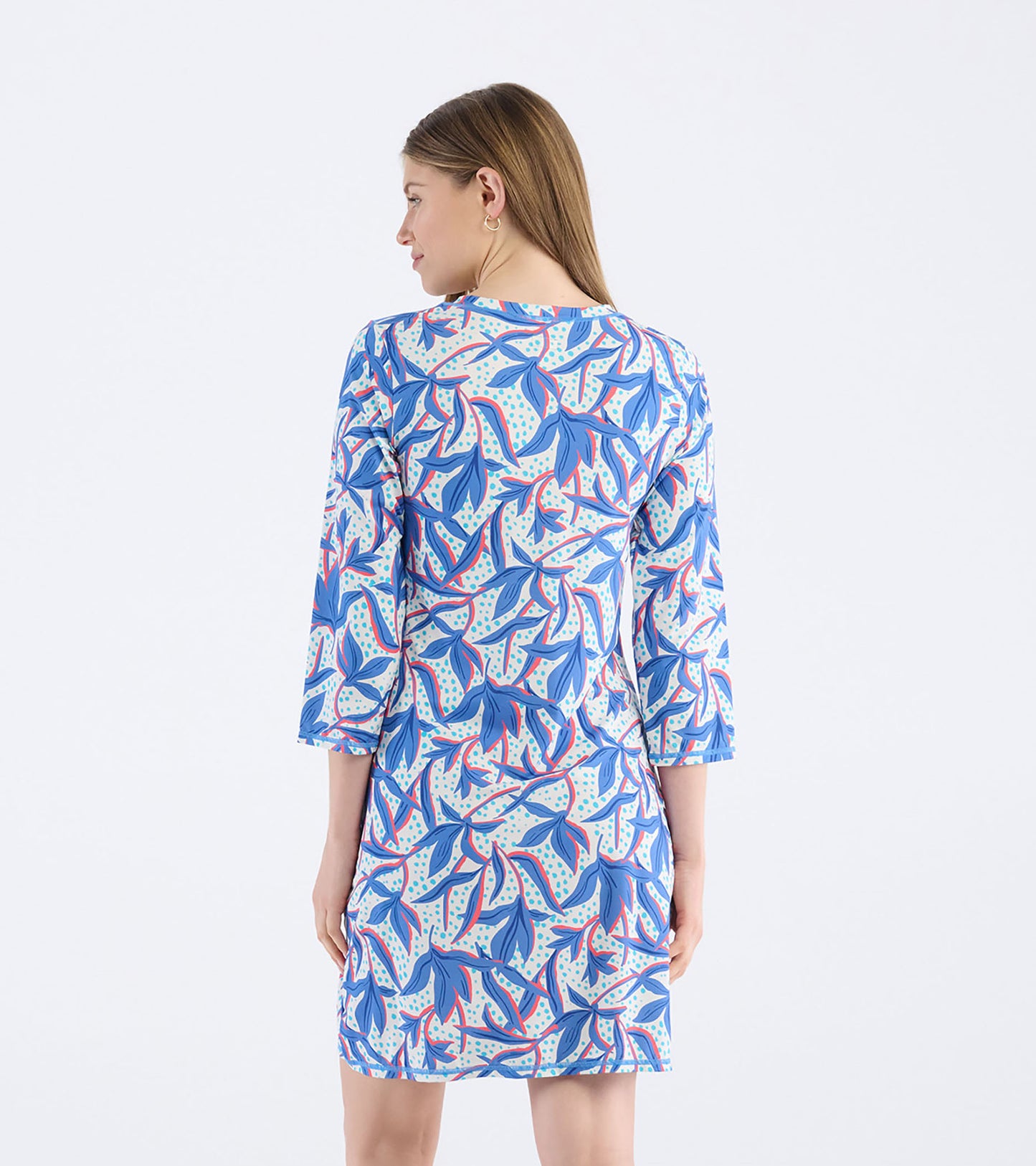 Back view of a short dress featuring a leafy floral pattern in blue, white, and pink with three-quarter sleeves.