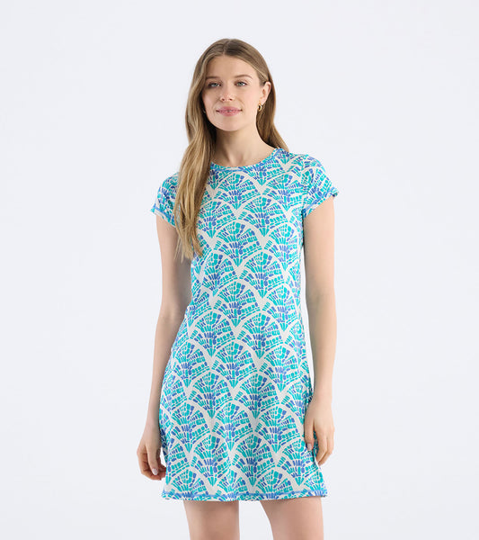 Short-sleeve t-shirt dress featuring a mosaic wave pattern in blue and purple on a light background.
