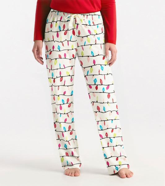 White pajama pants featuring a colorful holiday lights pattern, with an elastic waistband and drawstring.