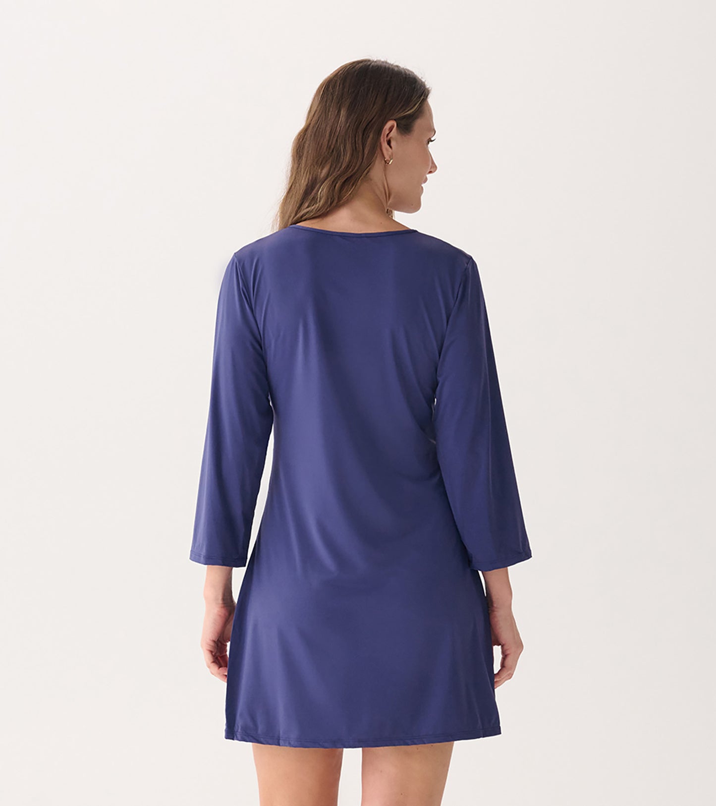 Back view of a women's short-sleeve beach dress in patriot blue, featuring a relaxed fit and soft fabric.
