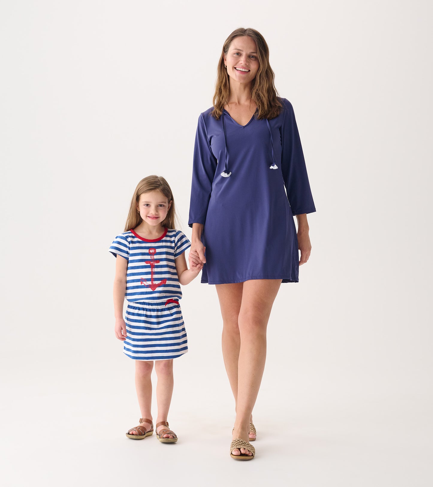 Patriot blue beach dress with a V-neck and long sleeves, paired with a striped dress featuring an anchor design.
