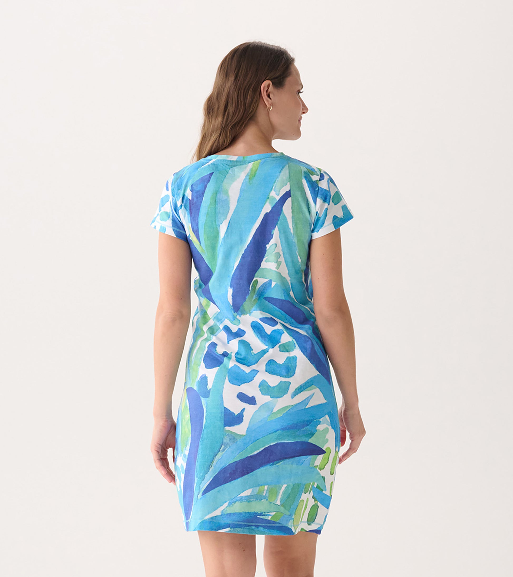 Short-sleeve crew neck dress featuring a vibrant blue and green pineapple pattern, shown from the back.