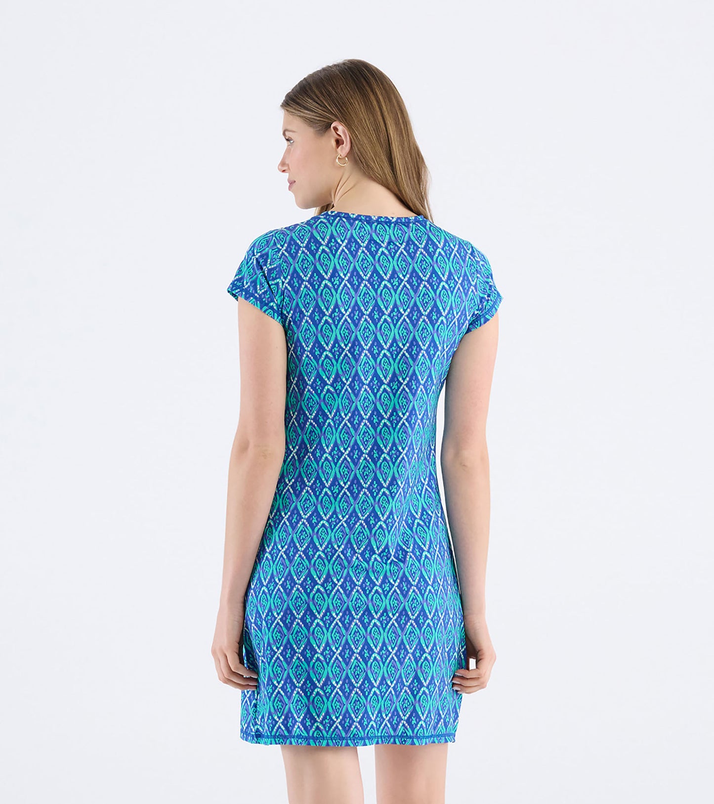 Blue t-shirt dress featuring a diamond pattern, cap sleeves, and a fitted silhouette, shown from the back.