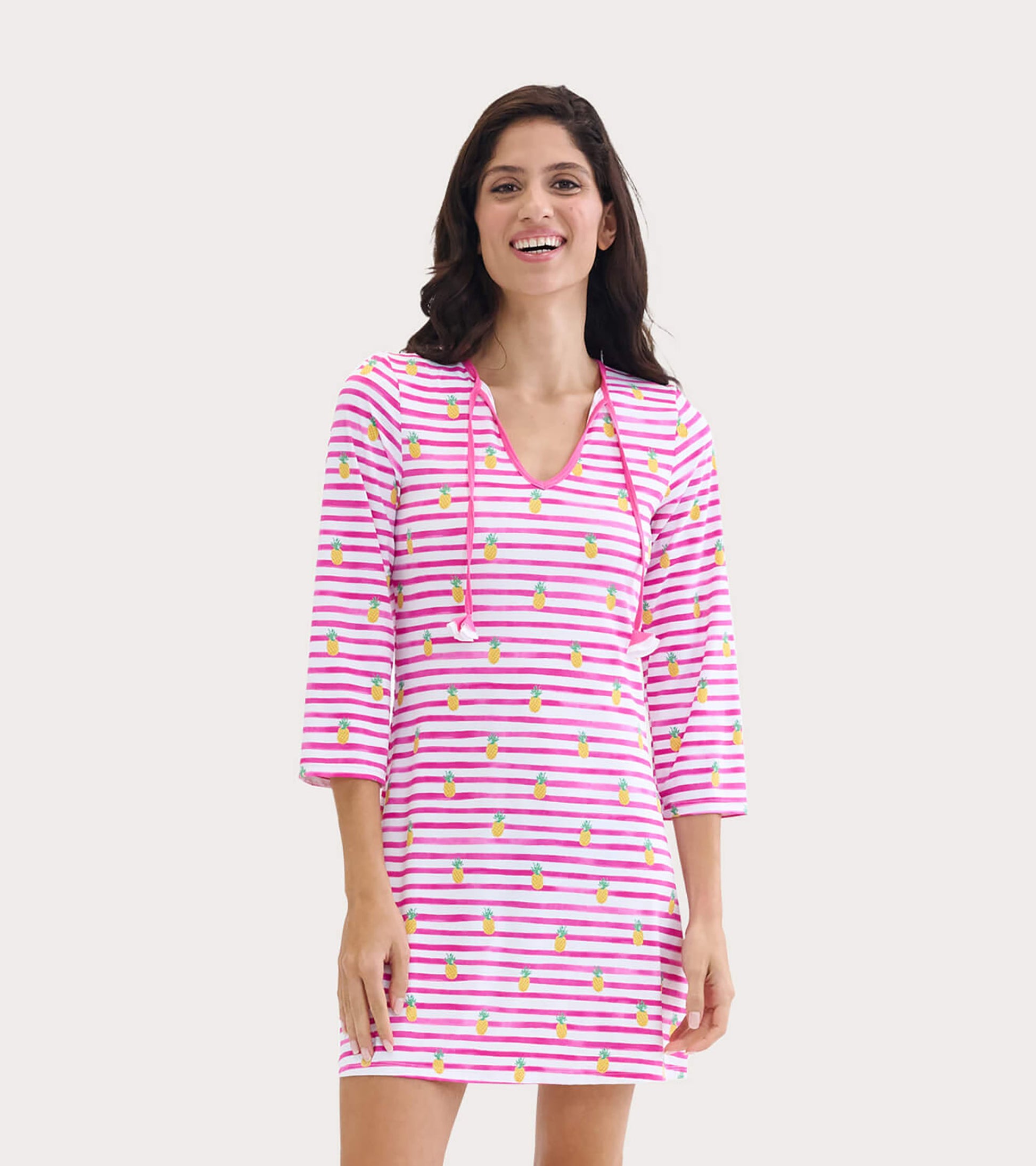 Pink and white striped beach dress with pineapple print, featuring a V-neck and three-quarter sleeves.
