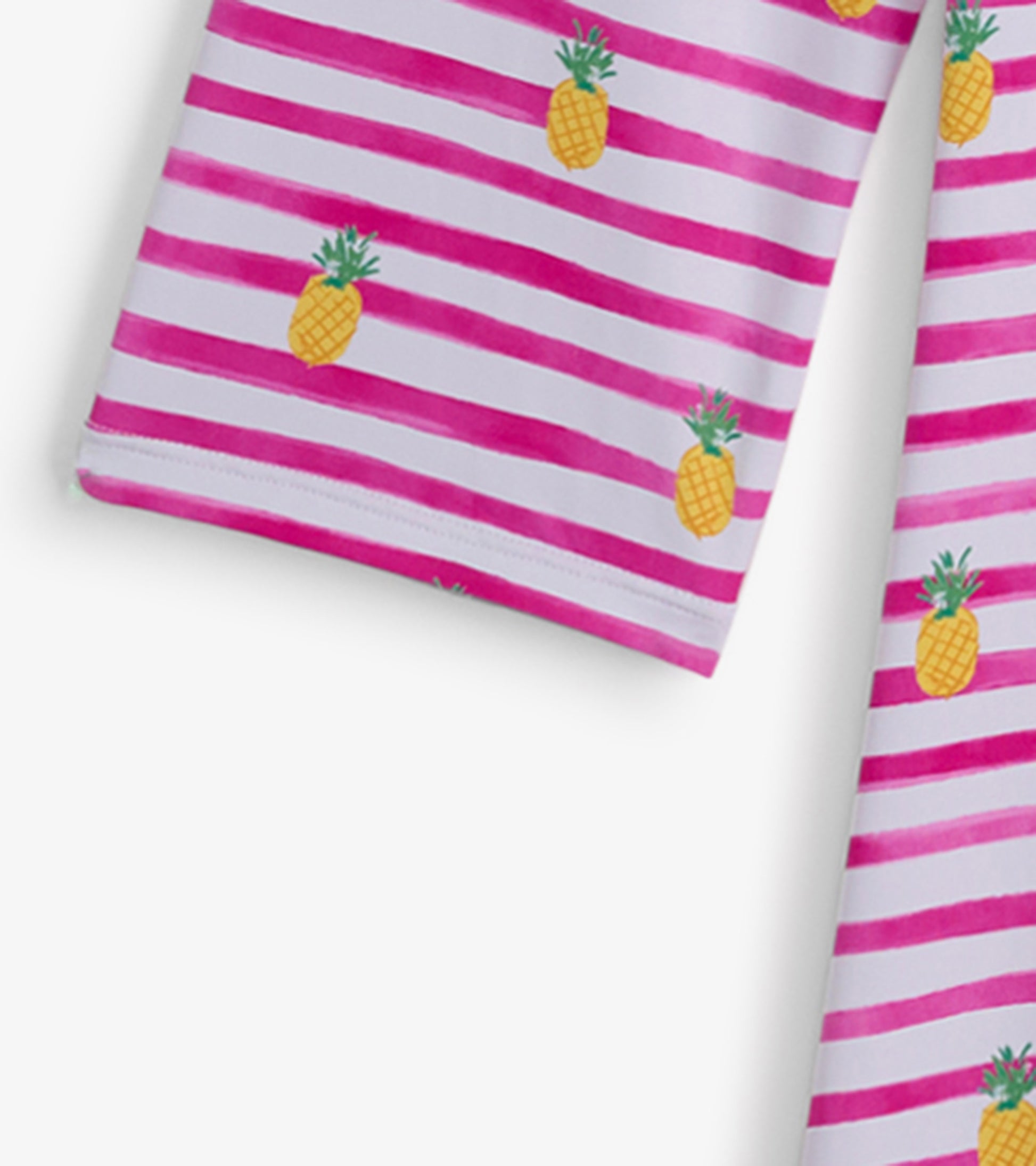 Pink and white striped beach dress featuring a pineapple pattern, suitable for seaside wear.