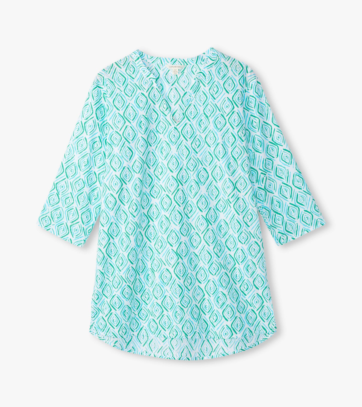 Light turquoise tunic with a diamond pattern and three-quarter sleeves, featuring a relaxed fit and a round neckline.