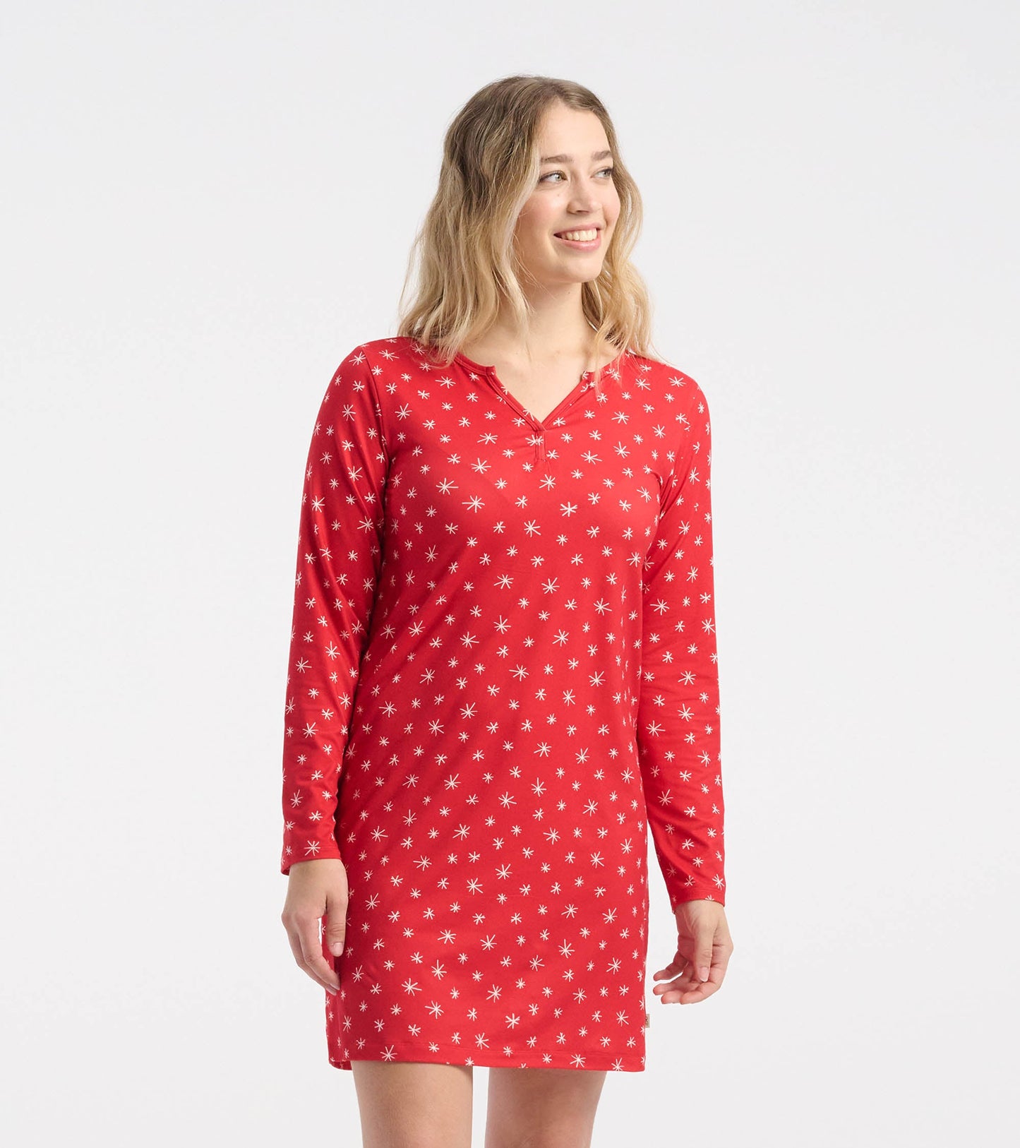 Red long sleeve nightshirt featuring a snowflake pattern, made from soft polyknit fabric, suitable for cozy wear.