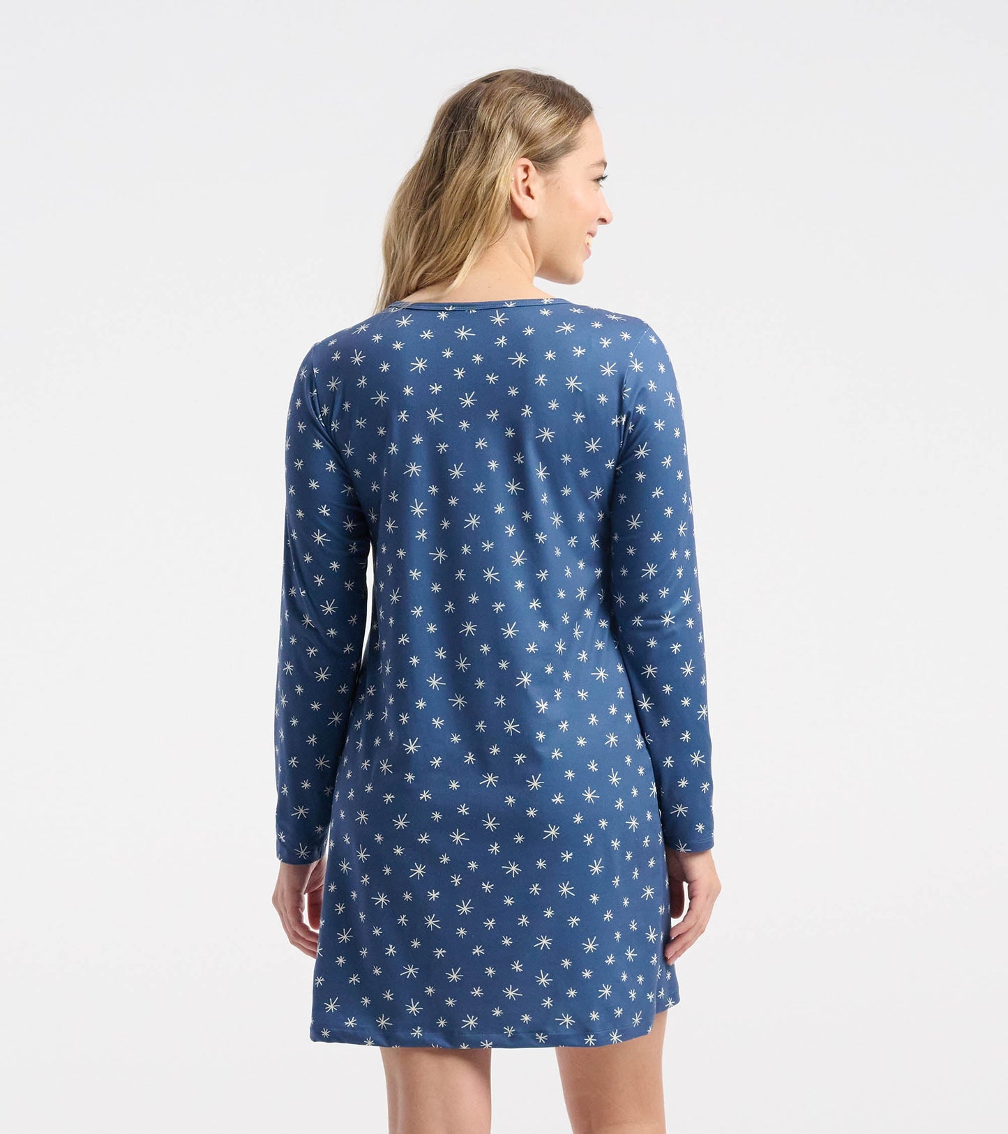 Blue long sleeve nightshirt with white snowflake pattern, featuring a relaxed fit and round neckline.