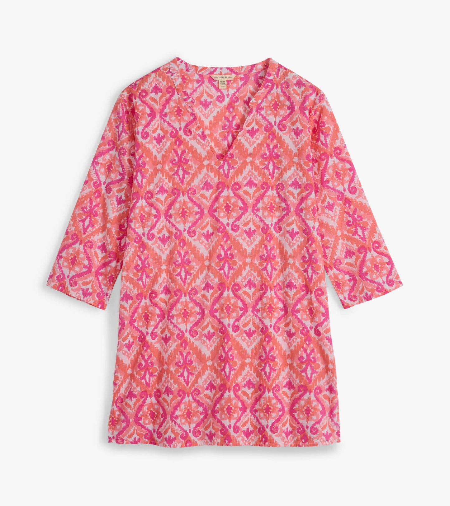 Pink and coral tunic featuring an ikat pattern with a V-neck and three-quarter sleeves, ideal for casual wear.