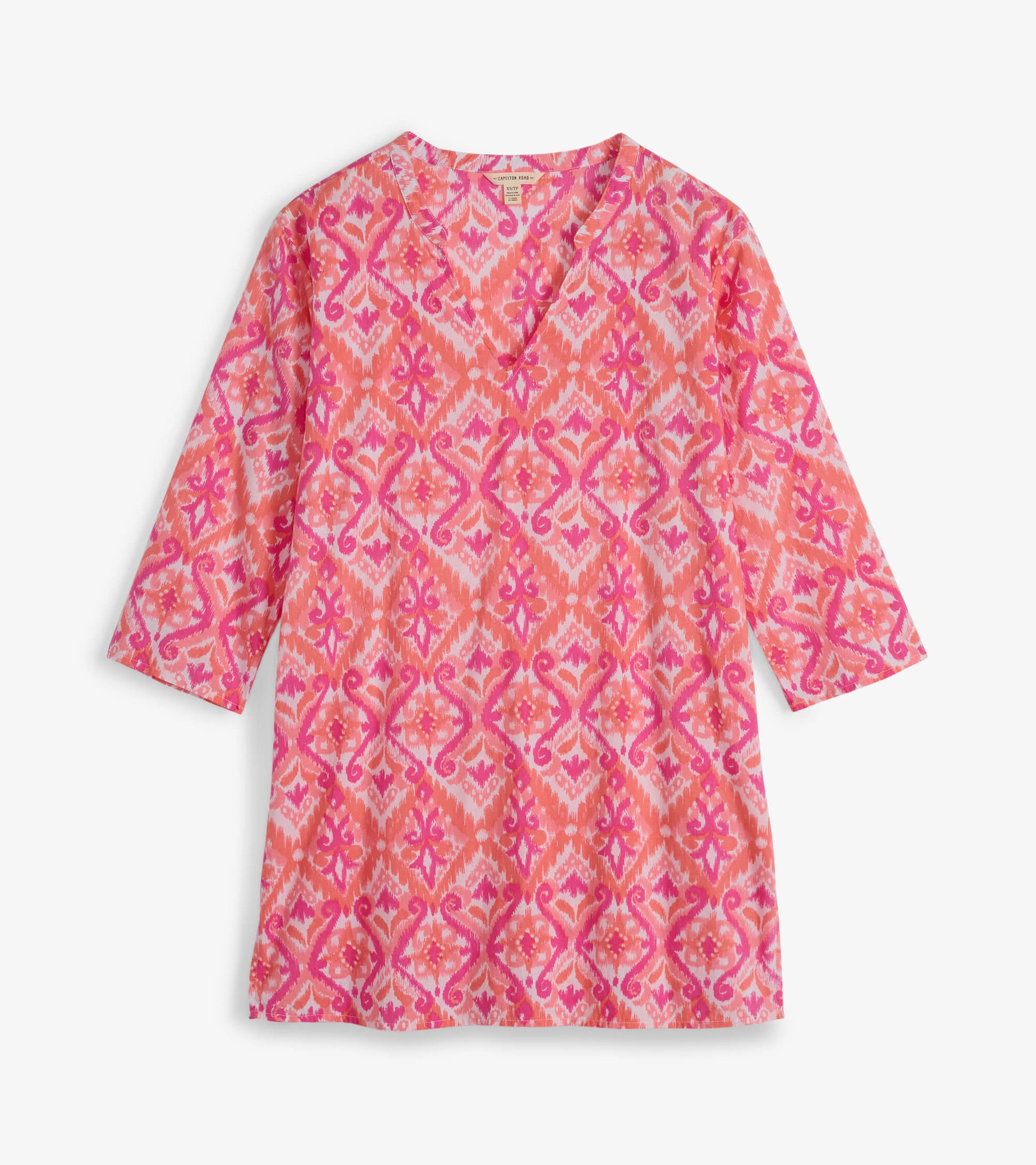 Pink and coral tunic featuring an ikat pattern with a V-neck and three-quarter sleeves, ideal for casual wear.